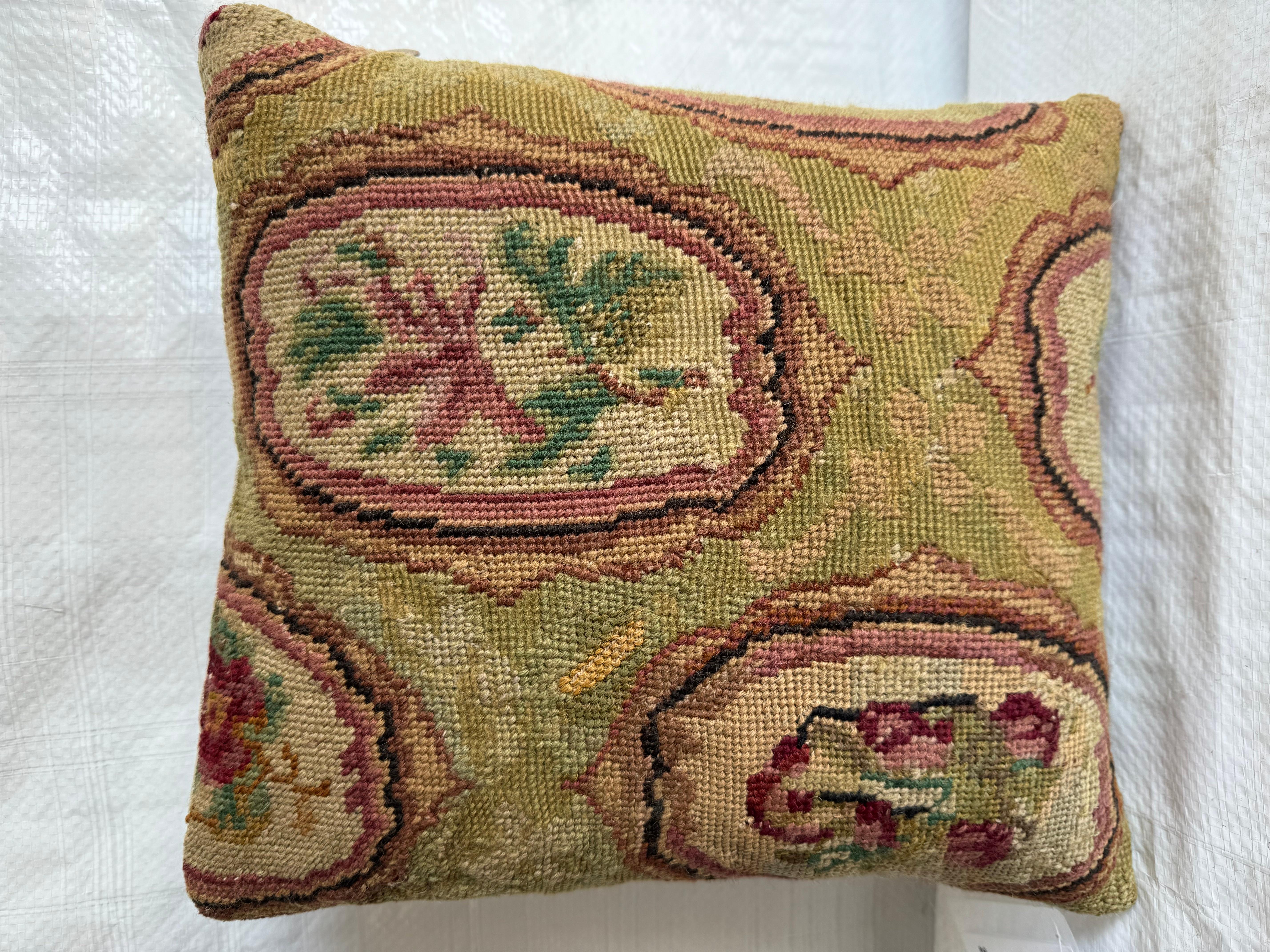 Experience the timeless allure of the Victorian era with our meticulously crafted 1850 English Needlework Pillow. Measuring 12