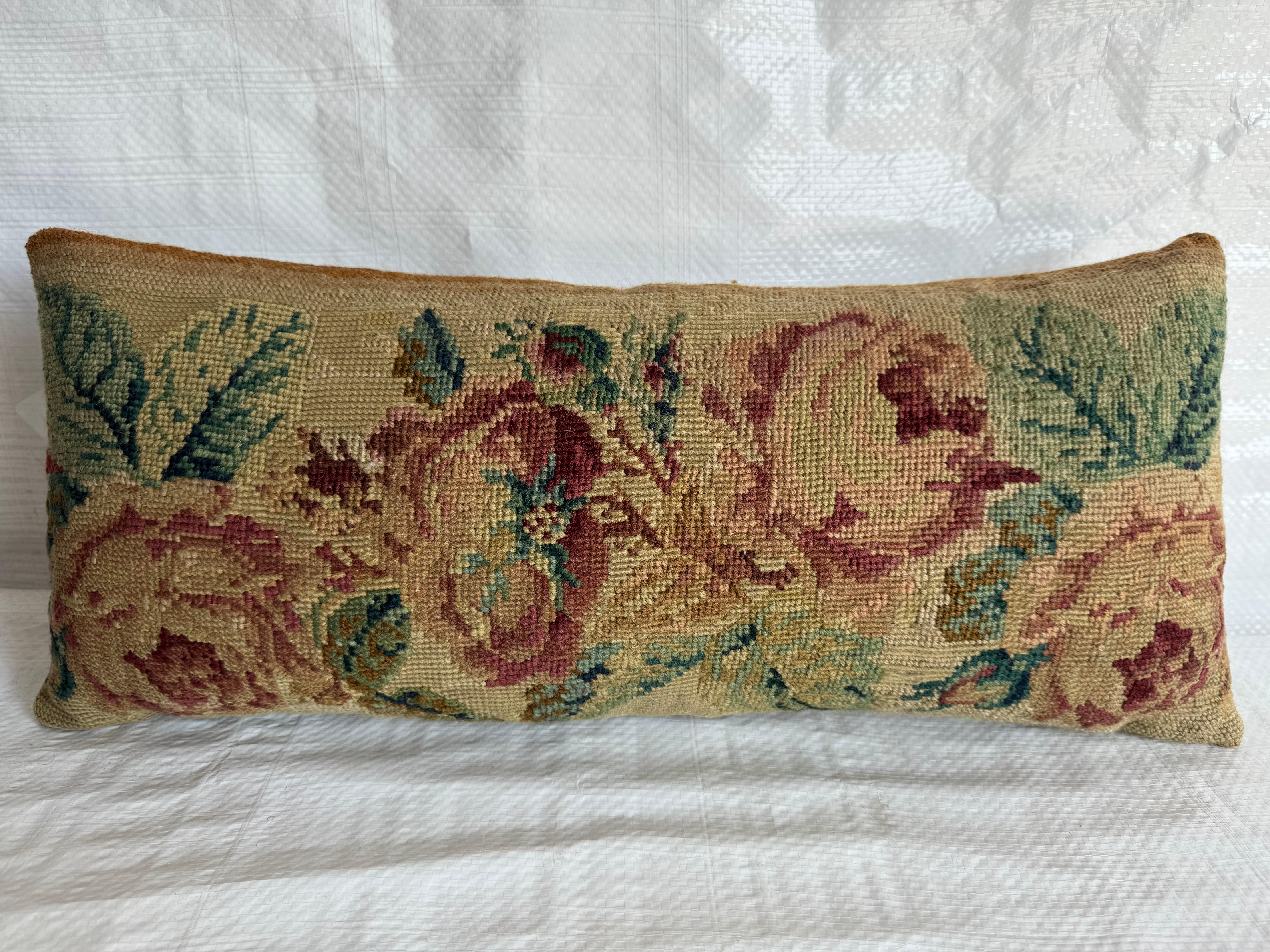 Indulge in the regal charm of the past with our stunning 1850 English Needlework Pillow, measuring 20