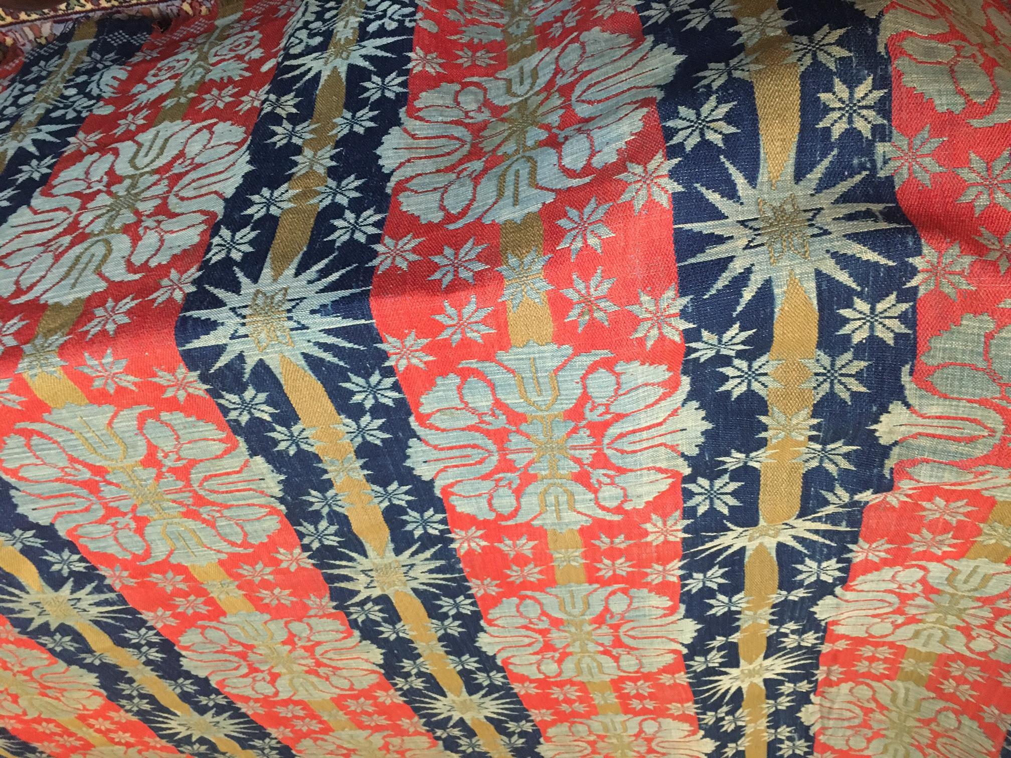 This lovely Jacquard coverlet was hand woven by C. Nicklas from Chambersburg, Pennsylvania for Martha Long in 1850.  Wool and cotton in vibrant brick-red, gold, cream and rich navy blue and featuring a floral medallion pattern with starbursts and