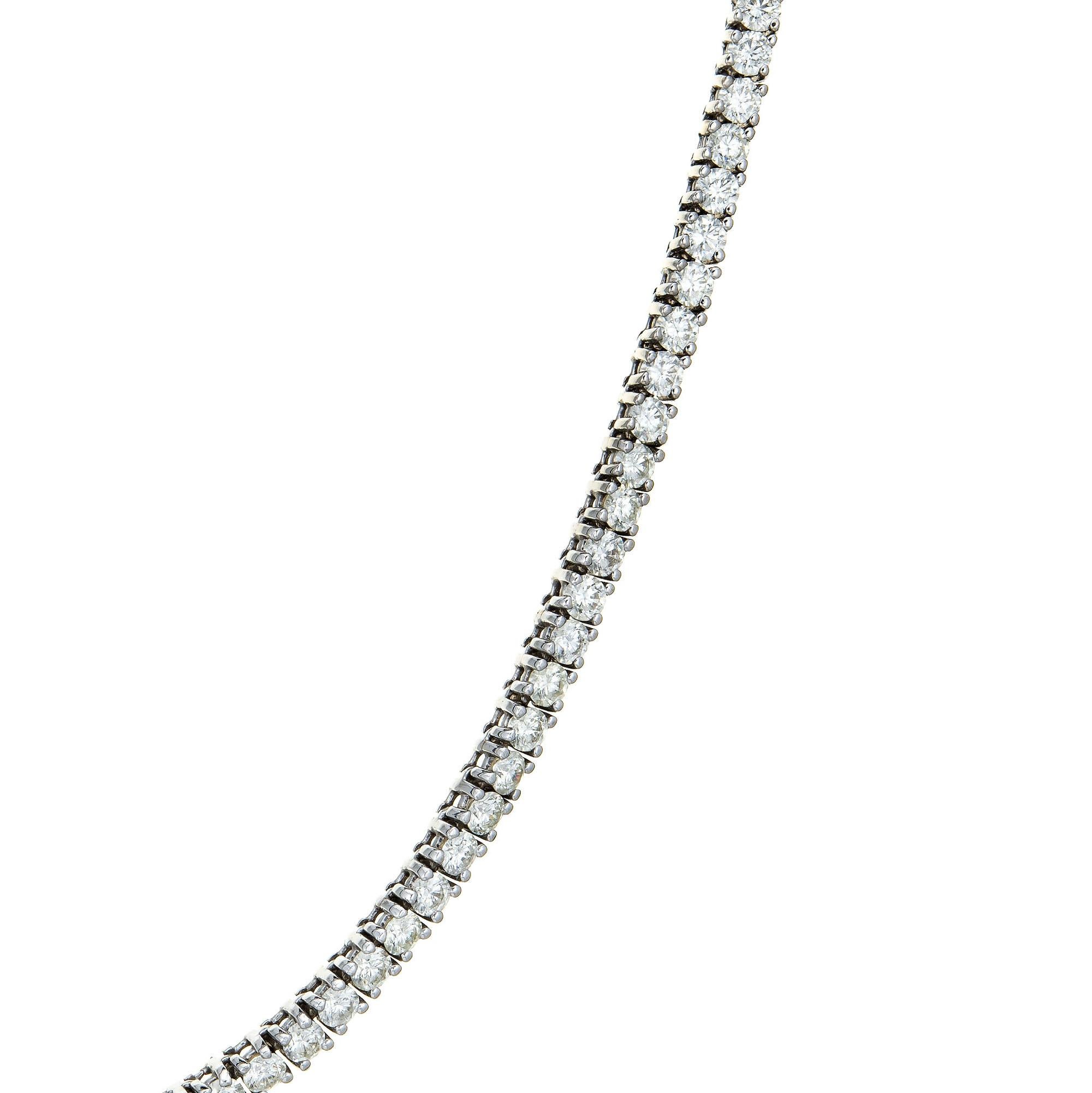 Stylish estate 18.50 carat diamond riviera necklace crafted in 14 karat white gold.  

Round brilliant cut diamonds total an estimated 18.50 carats (estimated at H-I color and SI2-SI2 clarity).

The standout necklace is set with full cut diamonds in