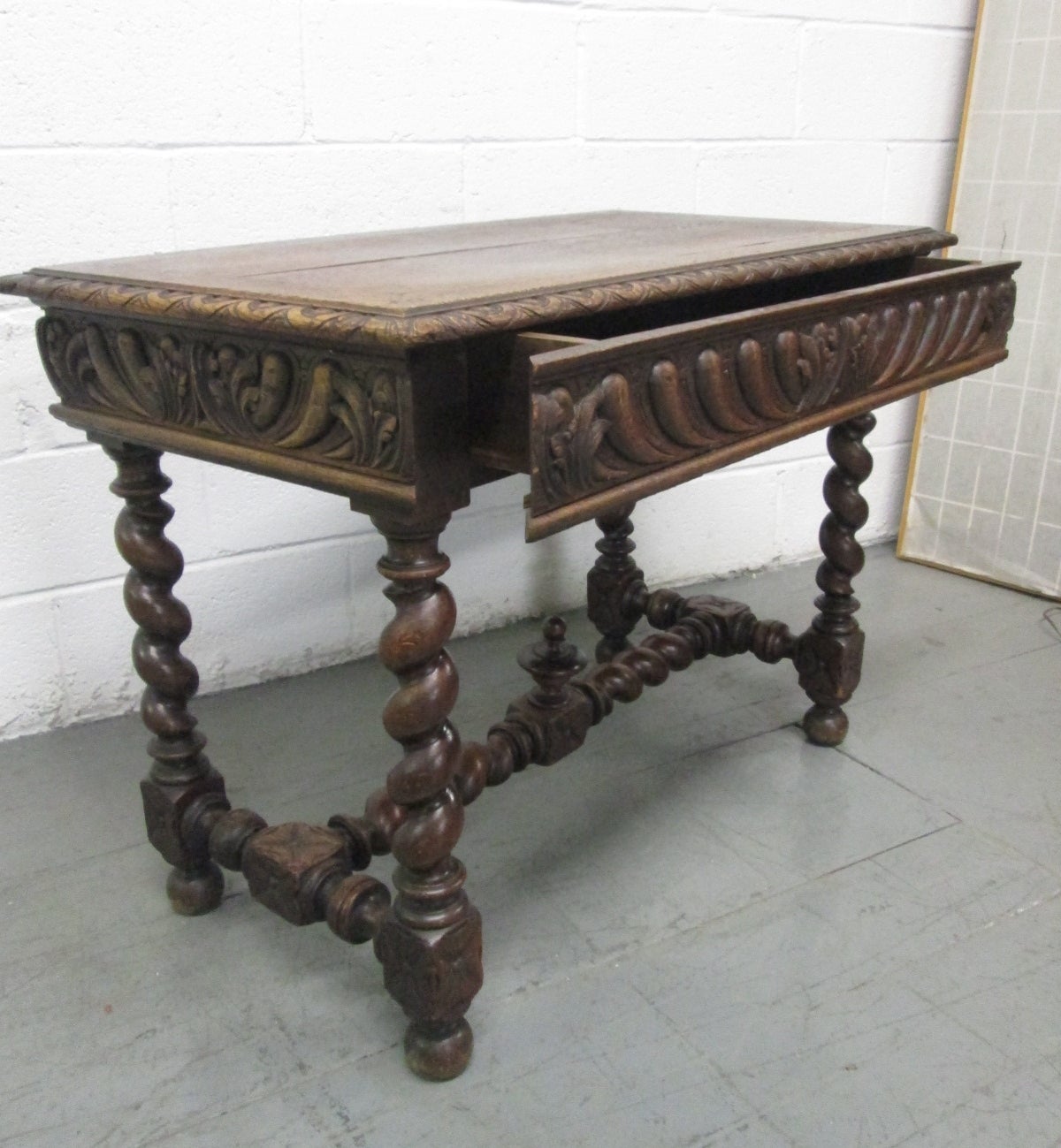 1850s Barley twist table. Has a single pull-out drawer and a finial to the center of the stretcher. Can also be used as a desk.