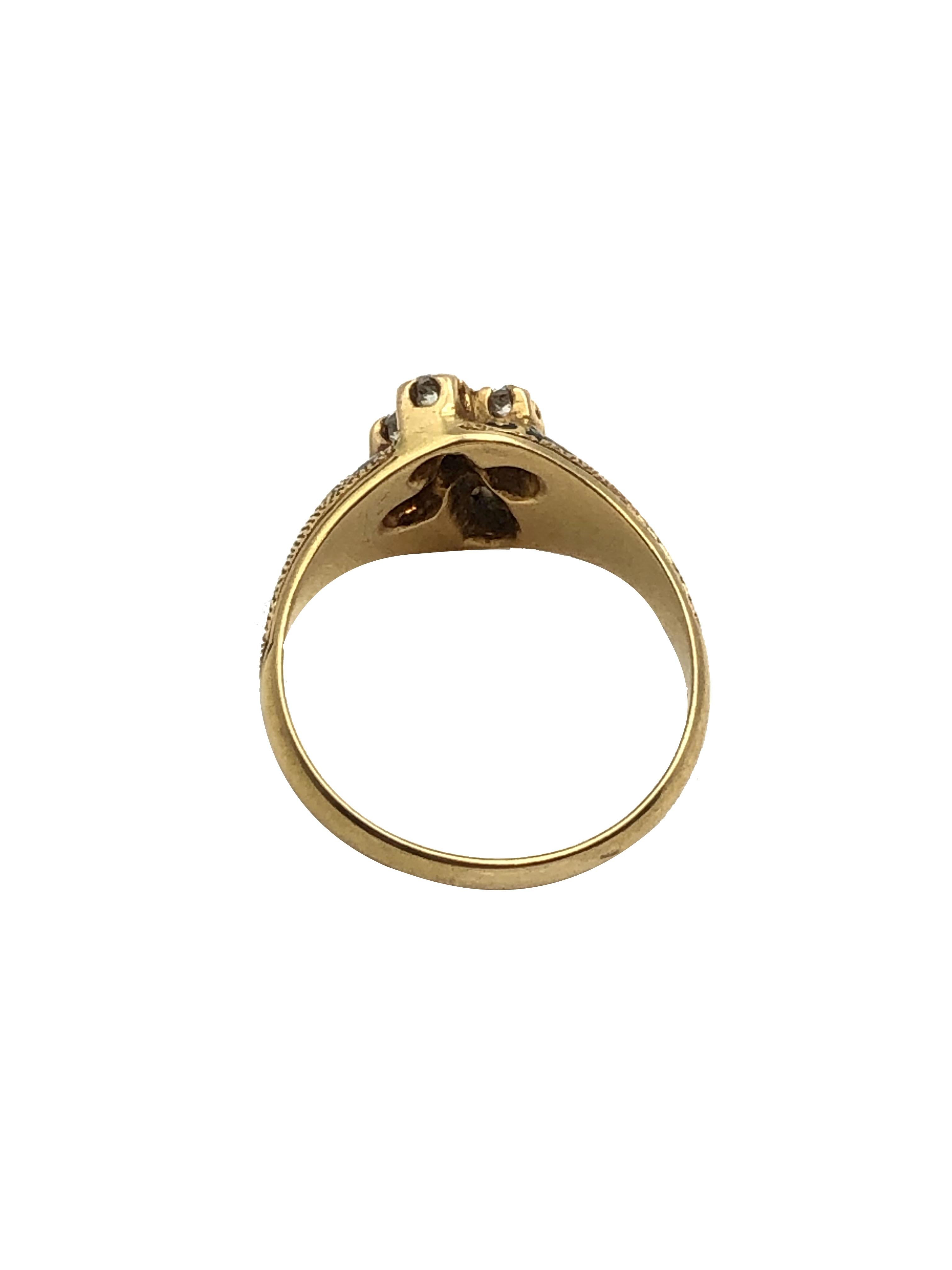 Circa 1850s 18K Yellow Gold Ring, the top with a raised Cross that is set with Old Mine cut Diamonds and measuring 1/2 X 3/8 inch, having Texturing design work and further decorated with Enamel. Finger size 6. 