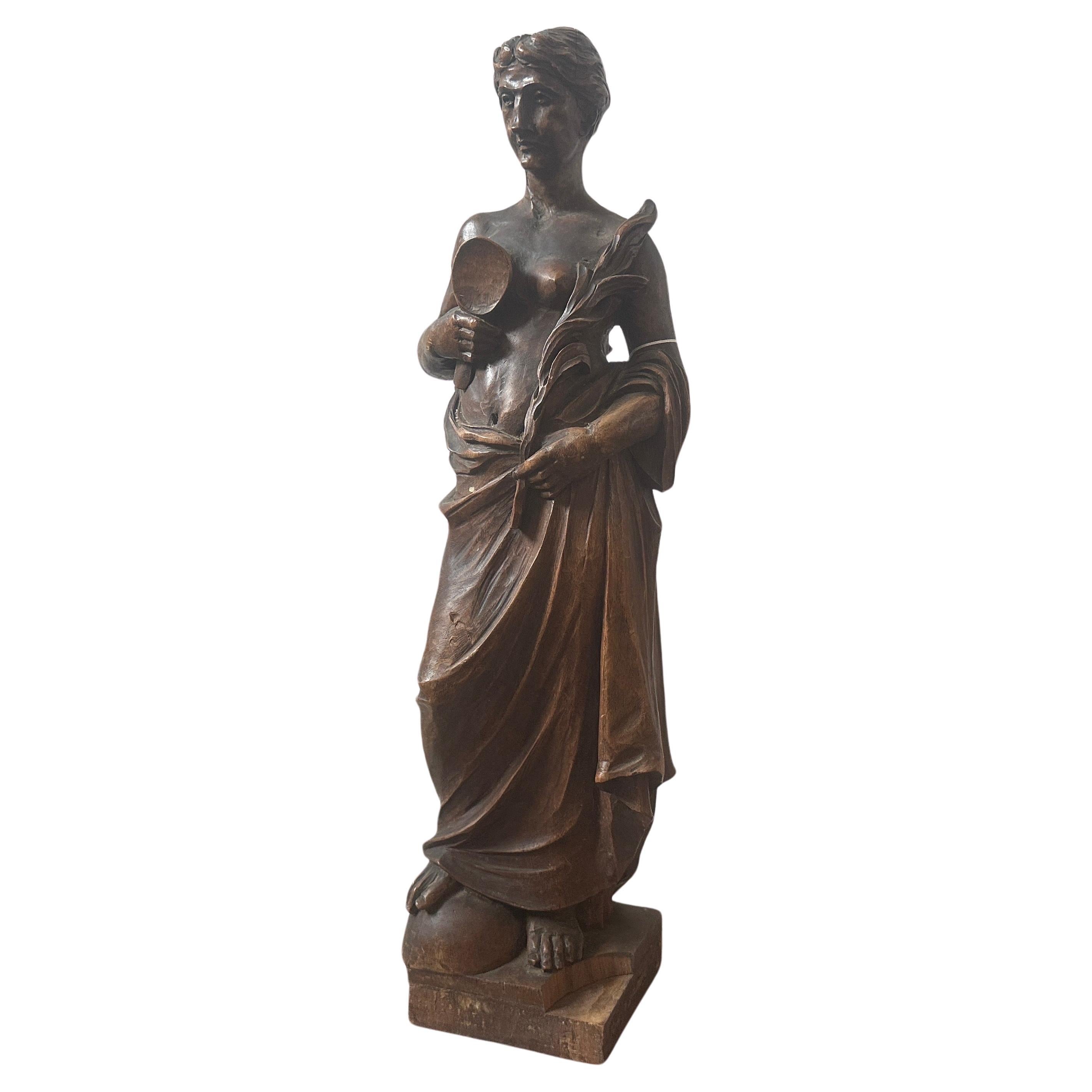 This Walnut Italian Sculpture of a Roman Bather is a sublime example of the artistic ideals of its time. It embodies the classical principles of beauty and balance while showcasing the exceptional skill of the sculptor in bringing a moment of