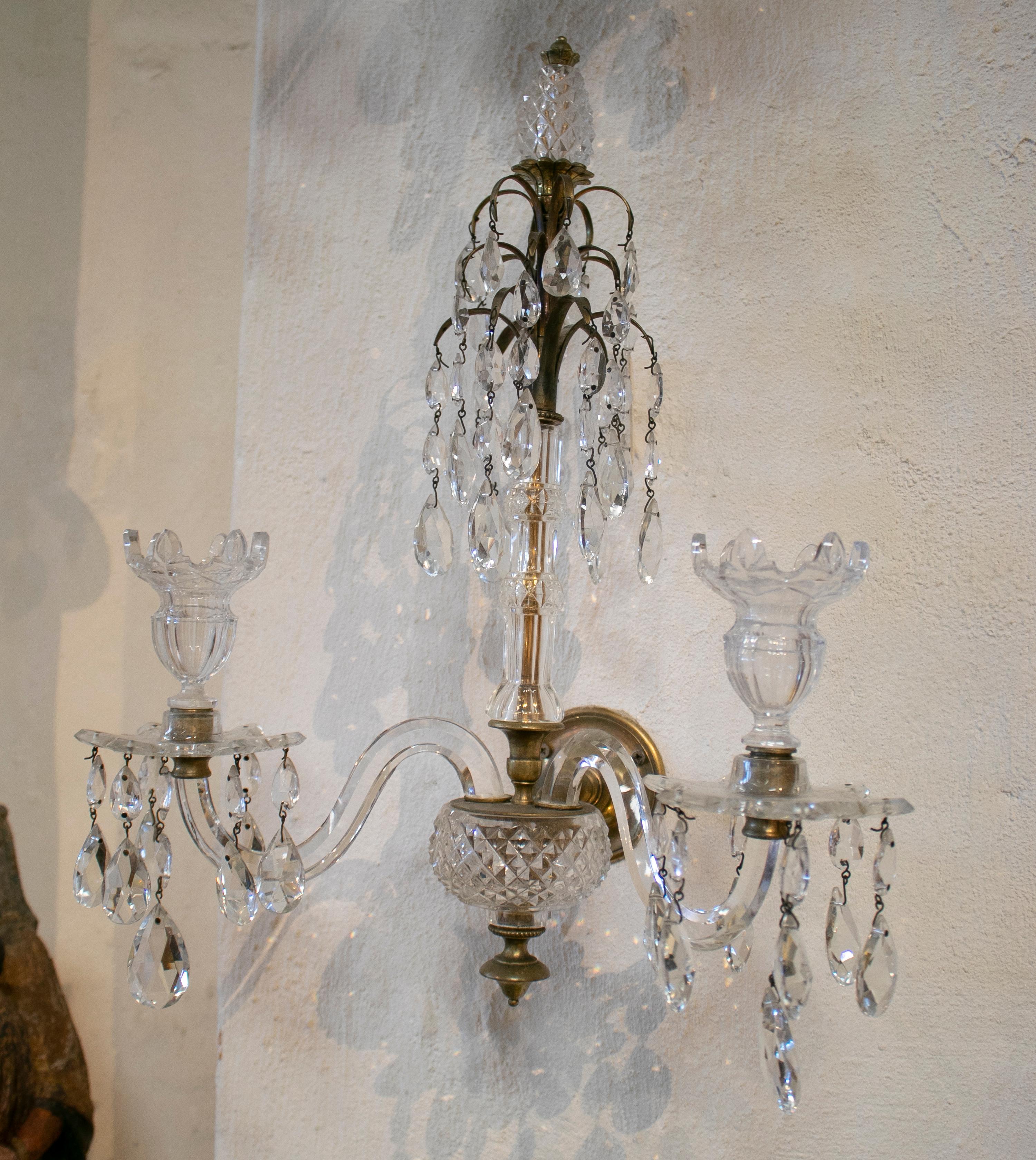 1850s pair of French Baccarat two-arm wall lamps.

Société Baccarat is a French company recognized as one of the most important in the glass design industry for its quality and texture. It is located in Baccarat and its museum displays the finest