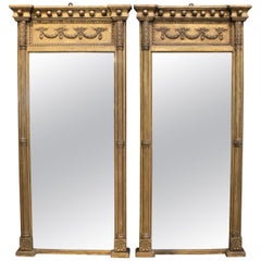 1850s Pair of French Empire Mirrors with Garland Decorated Gilded Wooden Frame