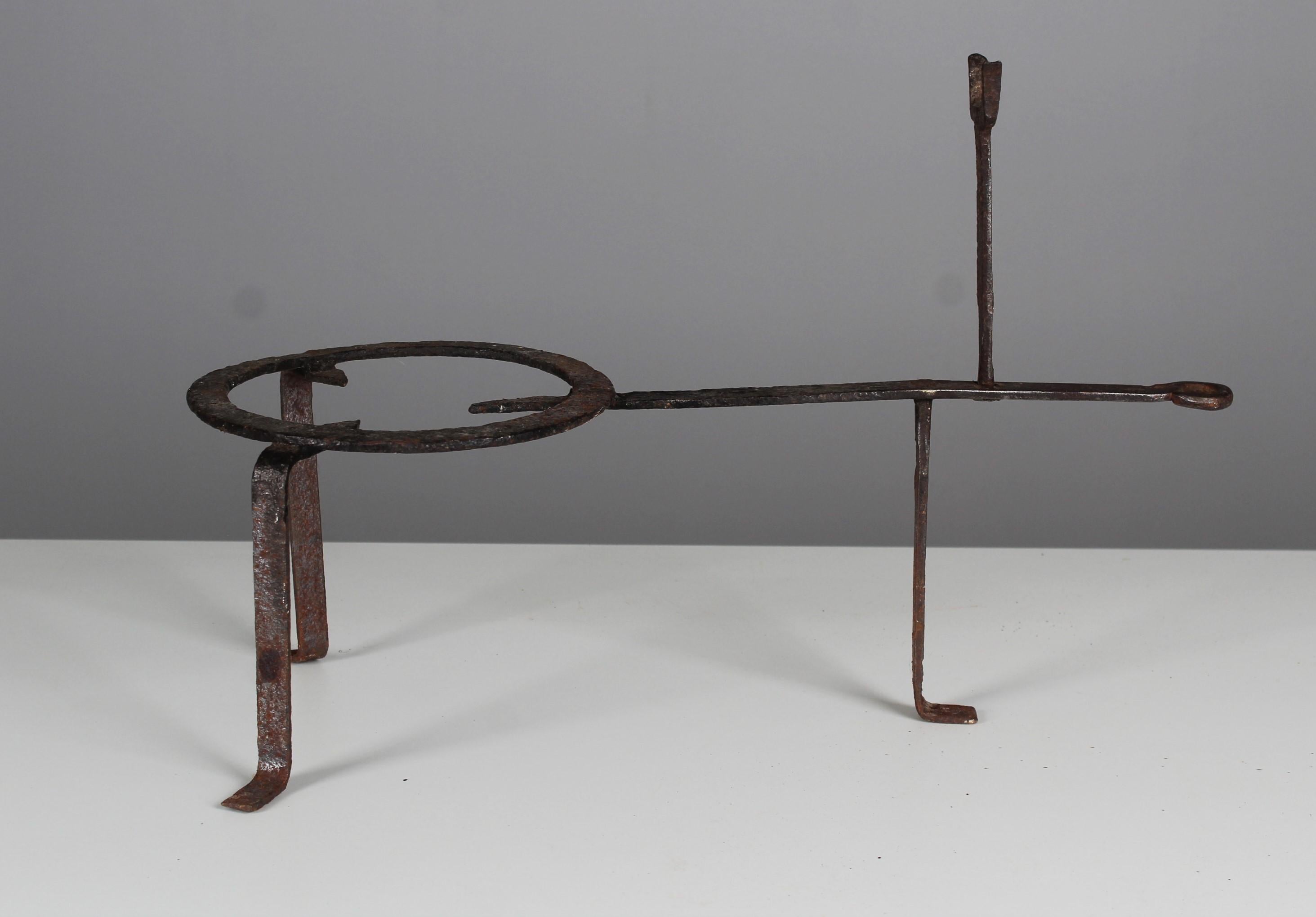 Antique pot rack, handmade of iron.
France, 19th century / maybe 17th century.
Solid iron in good condition according to its age.

In the 19th century, a lot of cooking was still done in the fireplace, on an open fire. The pot was placed on the
