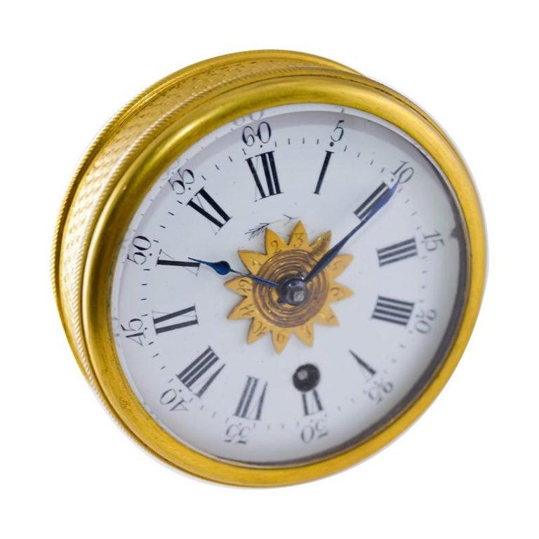 FACTORY / HOUSE: No Name, Swiss Made 
STYLE / REFERENCE: Alarm Travel Clock with Original Case 
METAL / MATERIAL: Gilded Brass
CIRCA / YEAR: 1850's
DIMENSIONS / SIZE: 2 1/4 Inches in Diameter 
MOVEMENT / CALIBER: Cylindrical Escapement Key Winding /