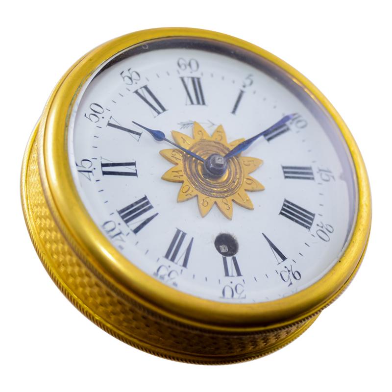 FACTORY / HOUSE: No Name, Swiss Made 
STYLE / REFERENCE: Alarm Travel Clock with Original Case 
METAL / MATERIAL: Gilded Brass
CIRCA / YEAR: 1850's
DIMENSIONS / SIZE:  2 1/4 Inches in Diameter 
MOVEMENT / CALIBER: Cylindrical Escapement  Key Winding