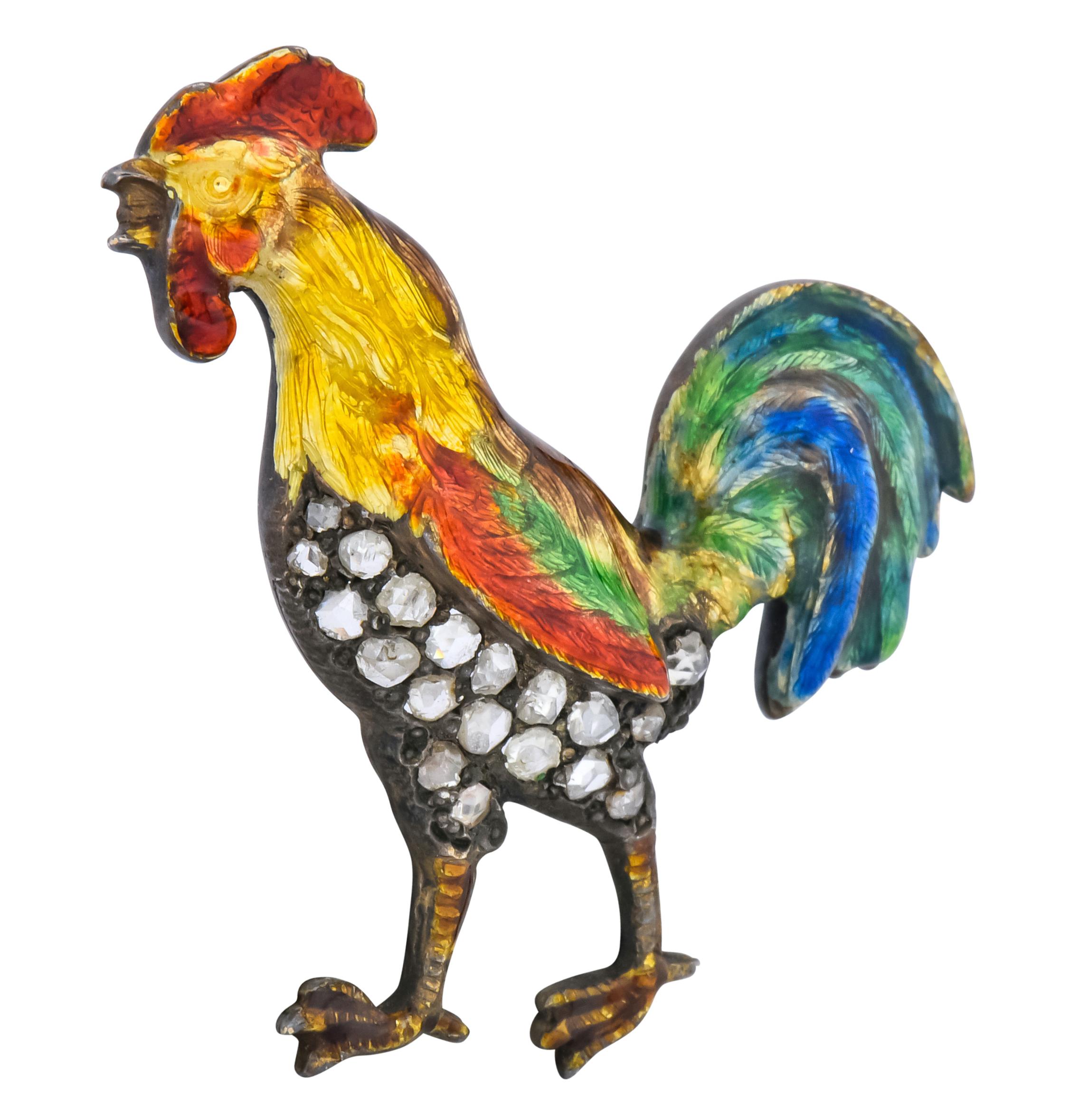 Brooch designed as a rooster with large voluminous tail feathers

Glossed with red, yellow, green, and blue enamel, little to no loss, consistent with age, wear, and use

Abdomen is accented with rose cut diamonds weighing approximately 0.45 carat