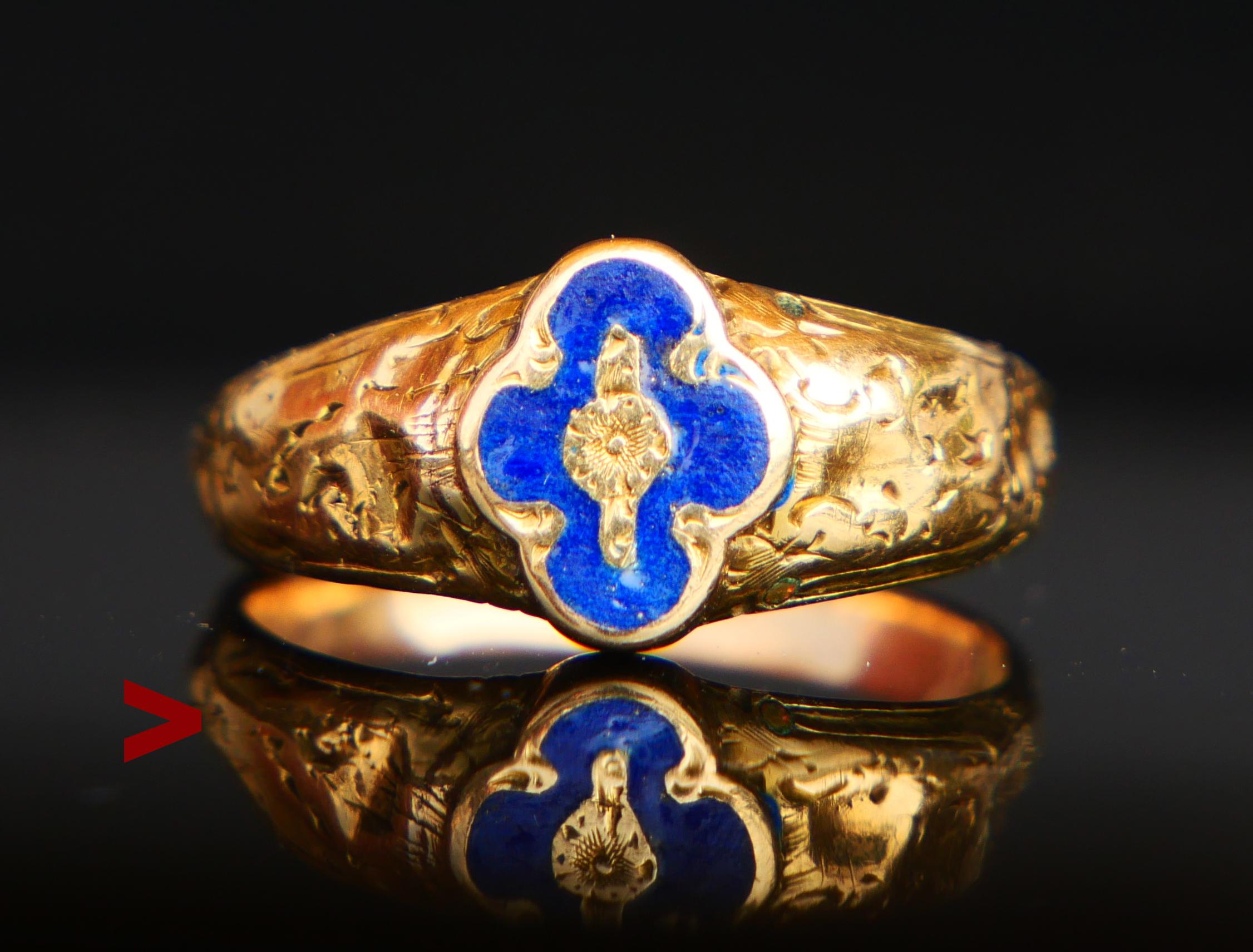 Poison Ring in solid 18K Yellow Gold with Blue enameled ornament on the face. Hollow band, shoulders with cast and engraved decorations.
On back side there is a hidden compartment covered with hinged lid. The lid shuts pretty tightly and can only be