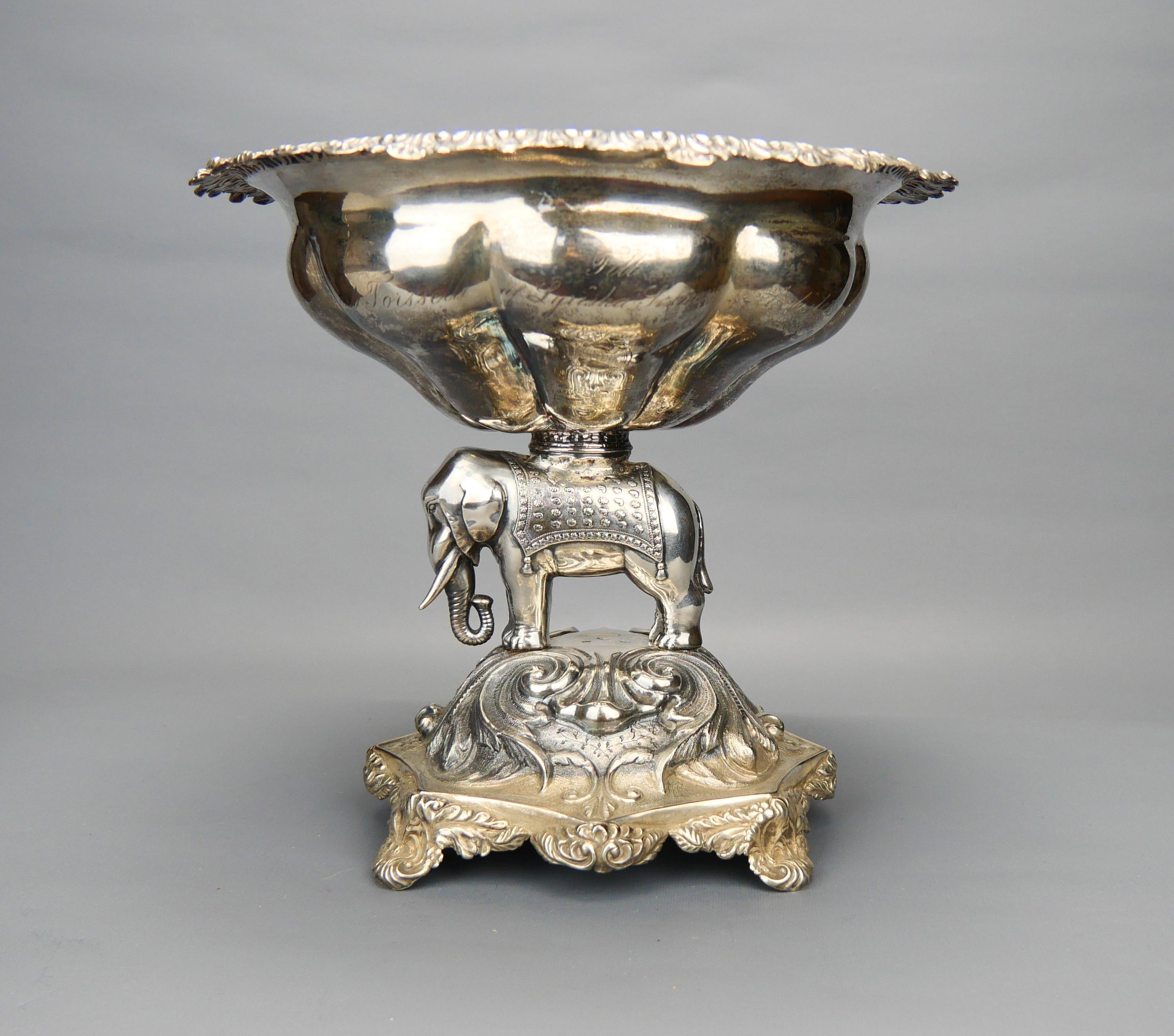 
Antique Swedish Centerpiece in solid 830 grade Silver with a realistic depiction of a cute Indian Elephant standing on lavishly decorated base supporting a bowl with gilt interior  trimmed with  leaves on the edge. Measures - about 18 cm high x