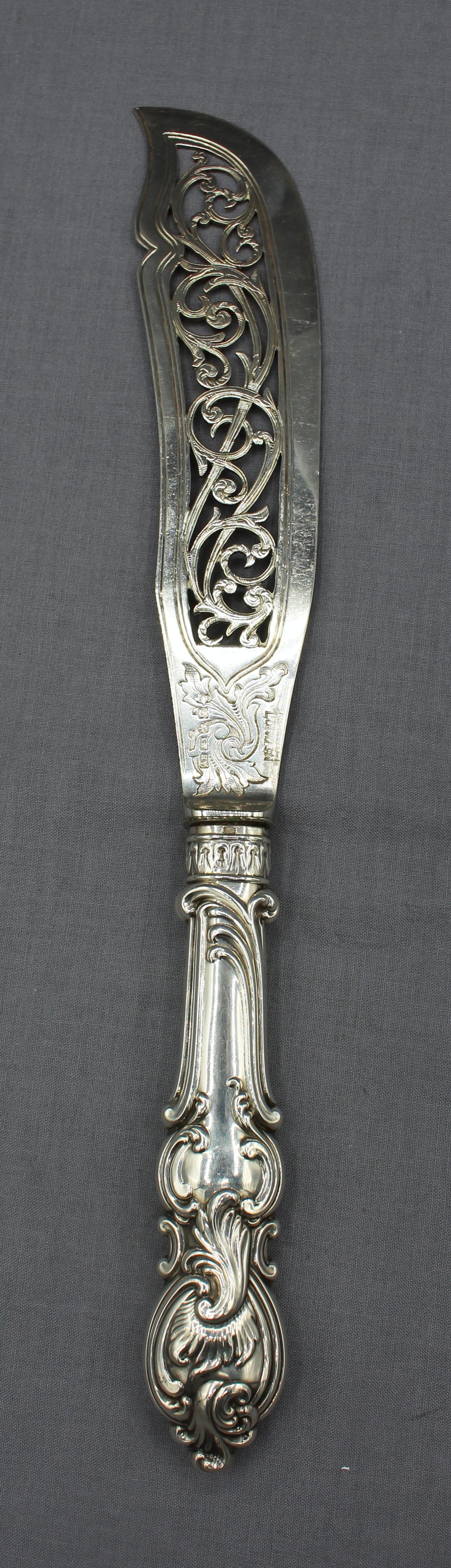 Pair of sterling handled fish servers, England, 1852. The fittings plated with cut work & engraving. A fine pair made by Aaron Hatfield & Sons, Birmingham, England.
Knife: 12.75