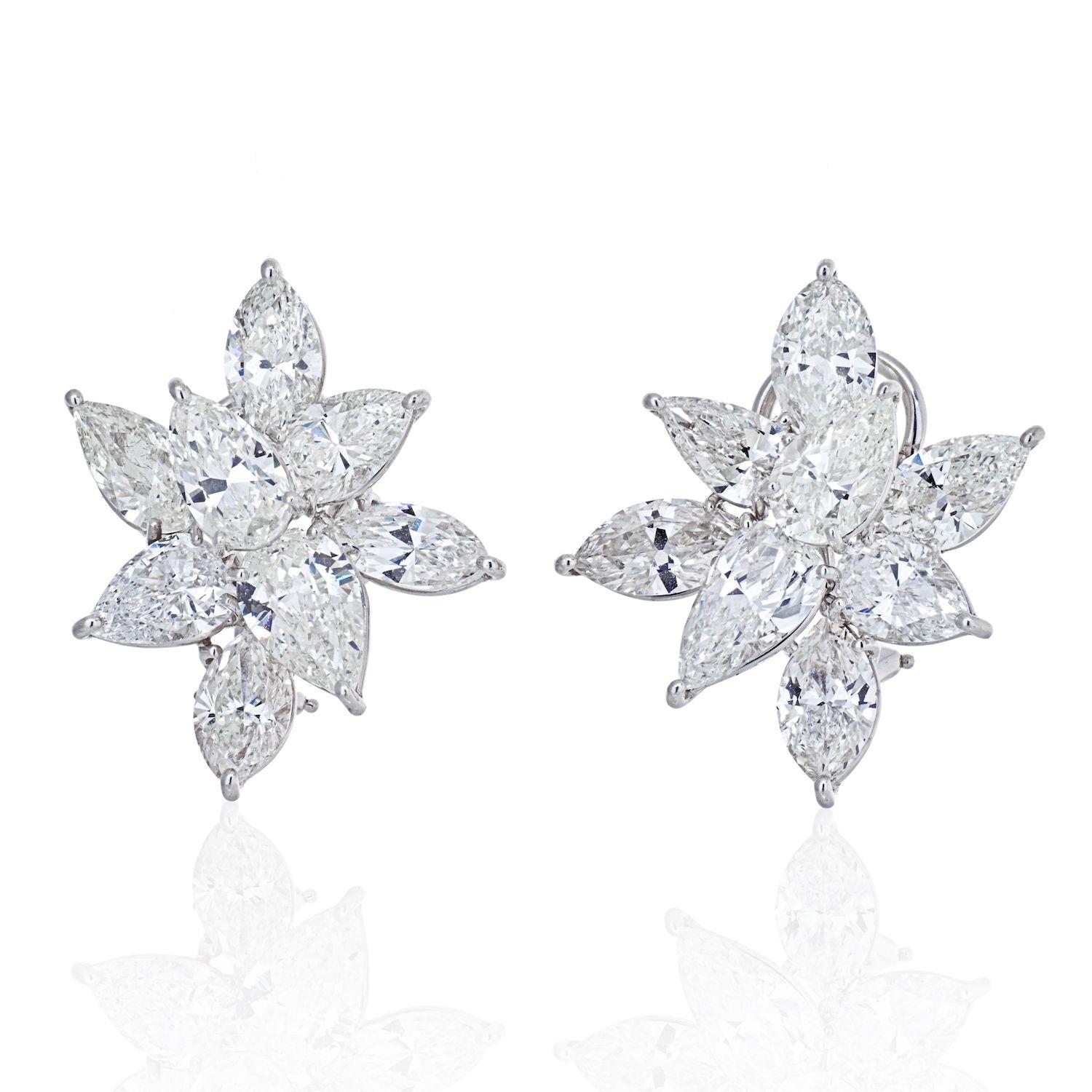 These stunning diamond earrings are exceptional in size, quality and brilliance. Nothing basic about these that's a guarantee! Your ear lobe will be encrusted with large cluster diamonds of a significant size: 6 Marquise cuts totaling 6.53cts and 10