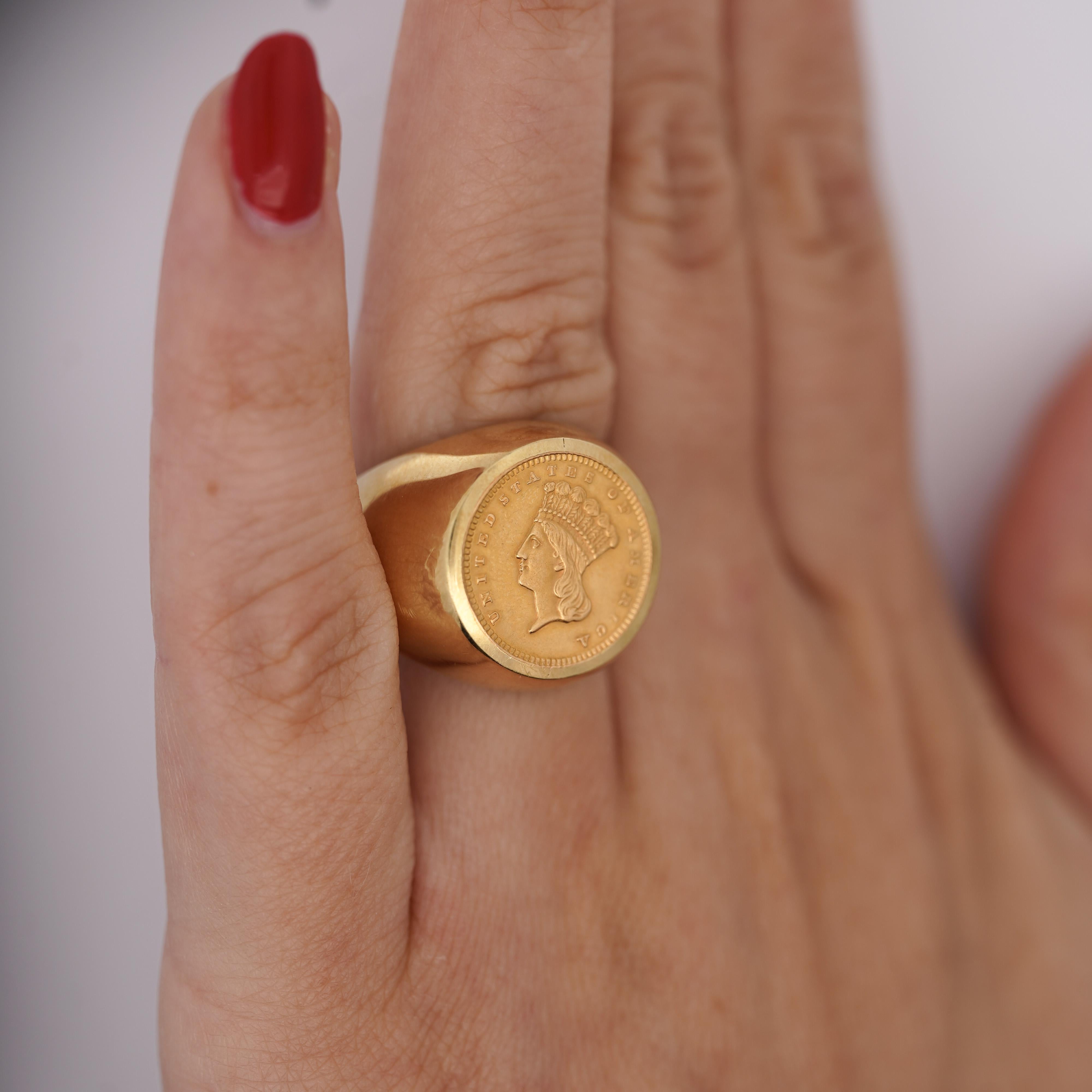 1856 Lady Liberty 1 Dollar Coin in 10K Yellow Gold Bezel Set Unisex Signet Ring in Size 6.

Details:
Item Type: Authentic 
Coin: 1856 Lady Liberty 1 Dollar Coin 
Metal: 14k Yellow Gold
Size: Ring Size 6
Color: Gold
Origin: United