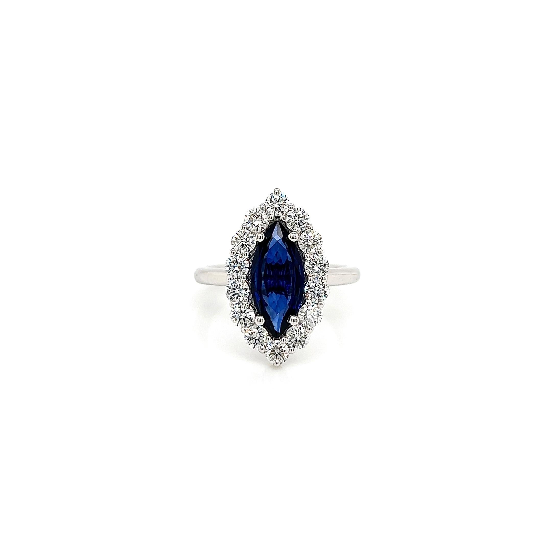 2.98 Total Carat Sapphire Diamond Ladies Ring

-Metal Type: 14K White Gold
-1.85 Carat Marquise Shaped Blue Sapphire
-1.13 Carat Round Side Diamonds 
-Size 6.5

Made in New York City.