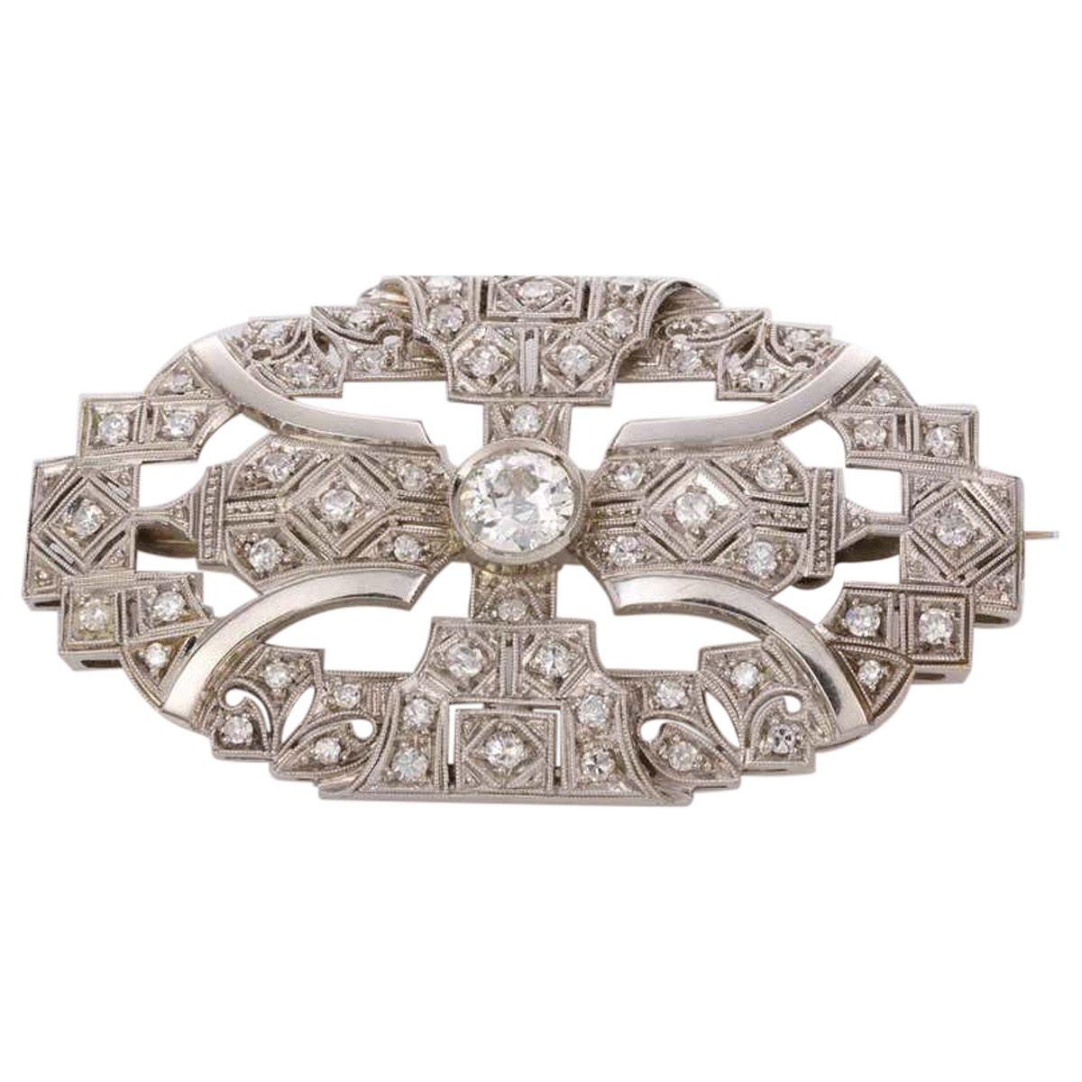 This is such a versatile piece of jewellery it would make a fabulous addition to any wardrobe. A fine handmade 18ct white gold Art Deco style pendant/brooch that showcases one bezel set central old European cut diamond weighing approximately 0.72ct,