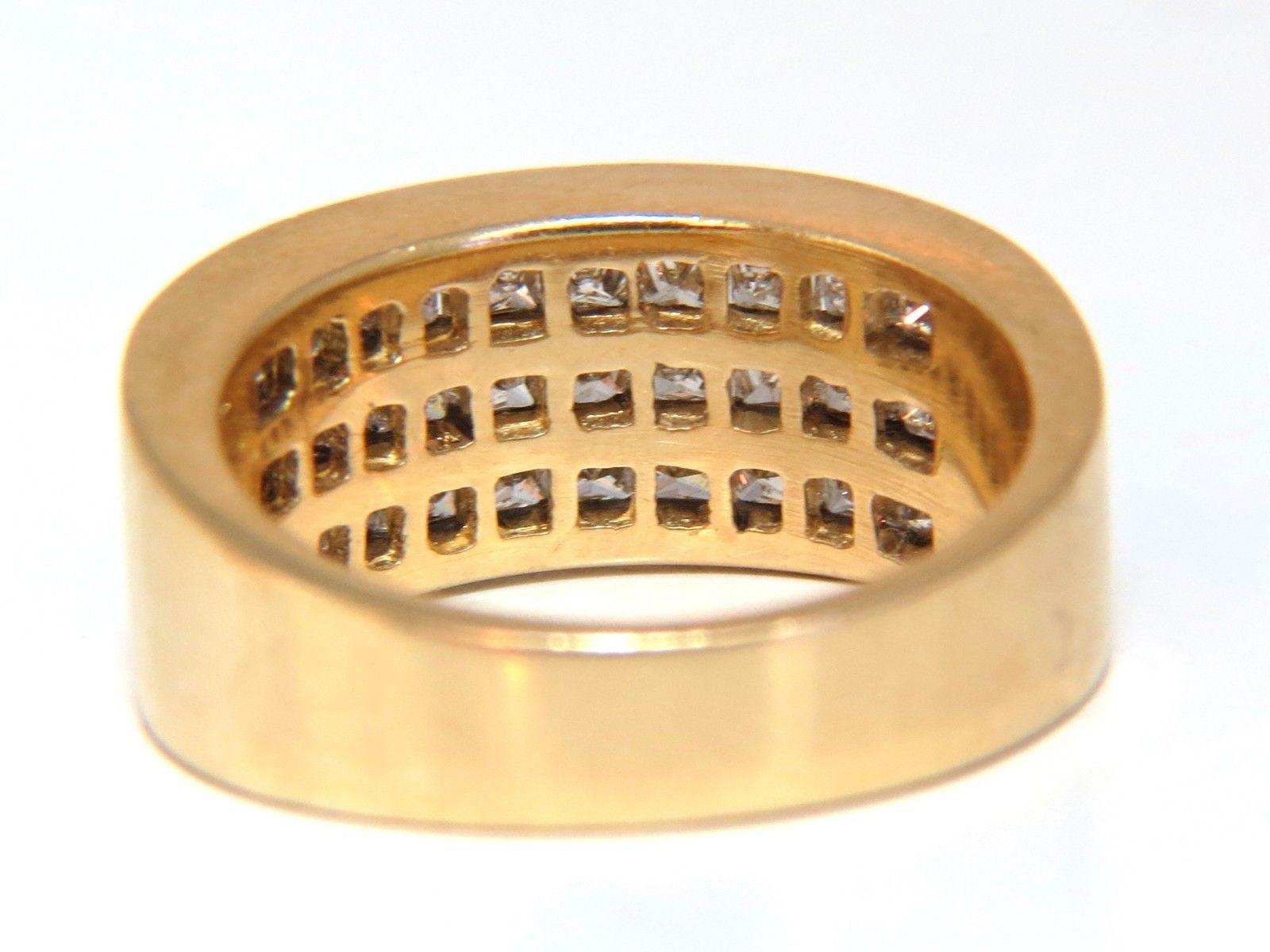 Princess Triple row wide smooth band.

1.86ct. natural princess cuts, channel set.

Vs-2 clarity

H-color

Natural, Earth Mined.

14kt. yellow gold.

7.6 grams.

Ring is 8.4mm wide 

current ring size: 

6.5

We may resize, please inquire

$6000