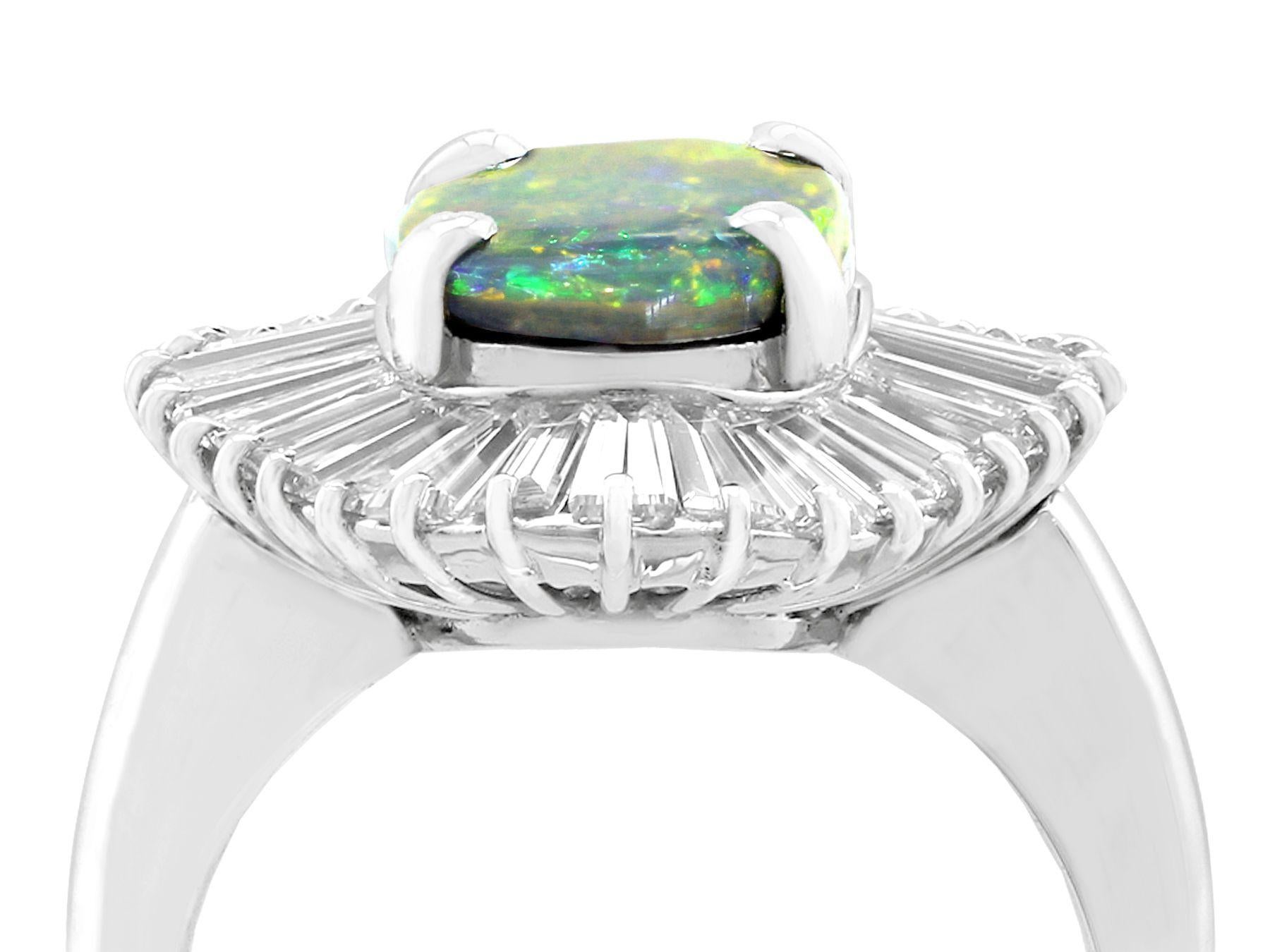 A stunning contemporary 1.86 carat opal and 3.22 carat diamond, platinum dress ring; part of our diverse opal estate jewelry collections.

This stunning, fine and impressive opal and diamond cluster ring has been crafted in platinum.

The