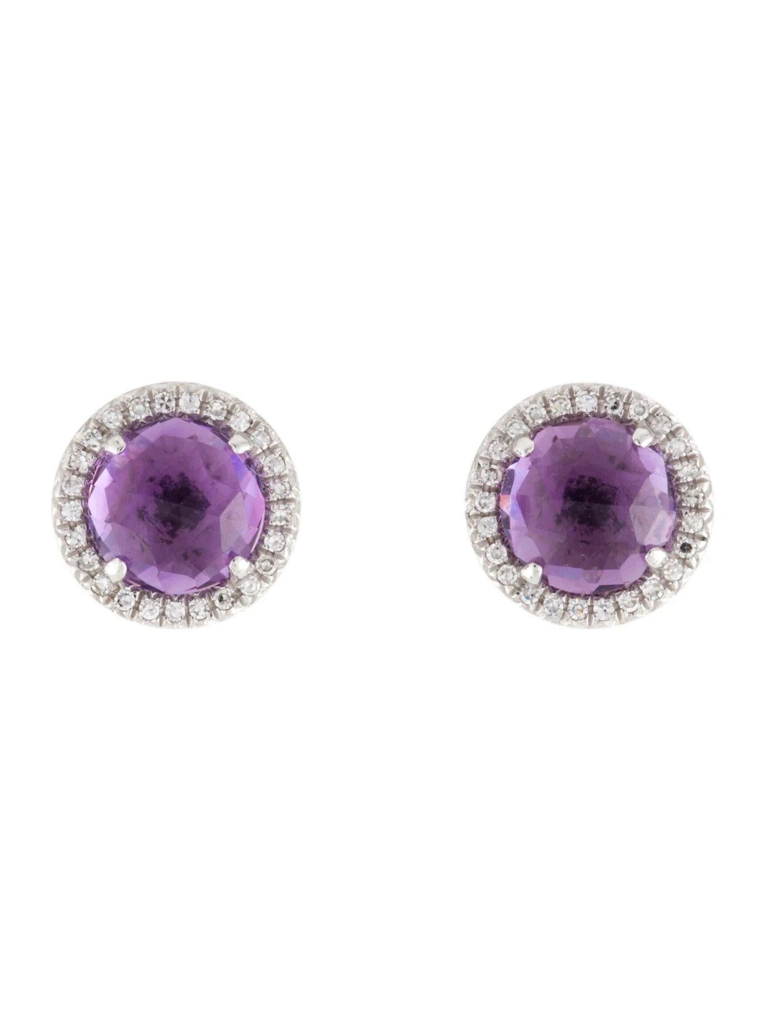These Amethyst & Diamond Earrings are a stunning and timeless accessory that can add a touch of glamour and sophistication to any outfit. 

These earrings each feature a 0.93 Carat Round Purple Amethyst, with a Diamond Halo comprised of 0.06 Carats