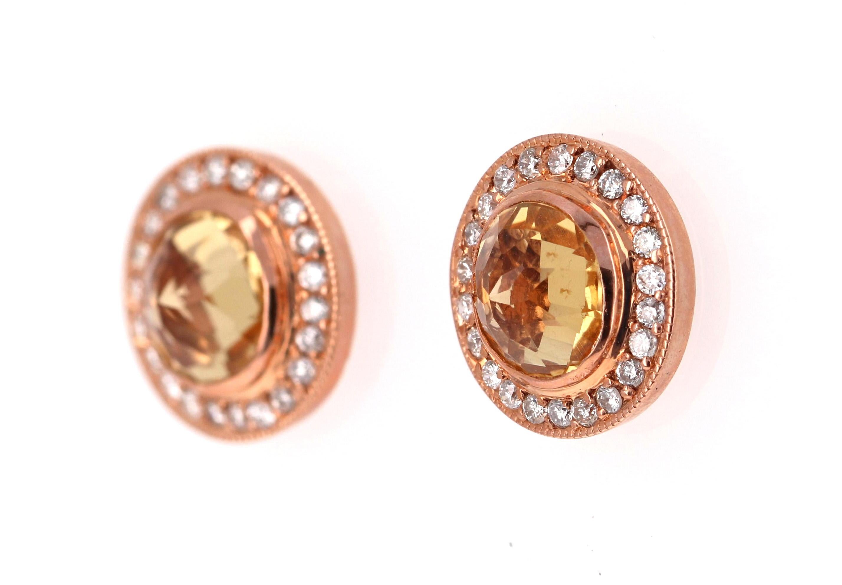 A cute and dainty pair of Citrine Earrings accented with some Diamonds!

These cute studs have 2 Round Cut Citrine stones that weigh 1.58 Carats and are surrounded by a beautiful halo of 44 Round Cut Diamonds that weigh 0.28 Carats. (Clarity: SI,