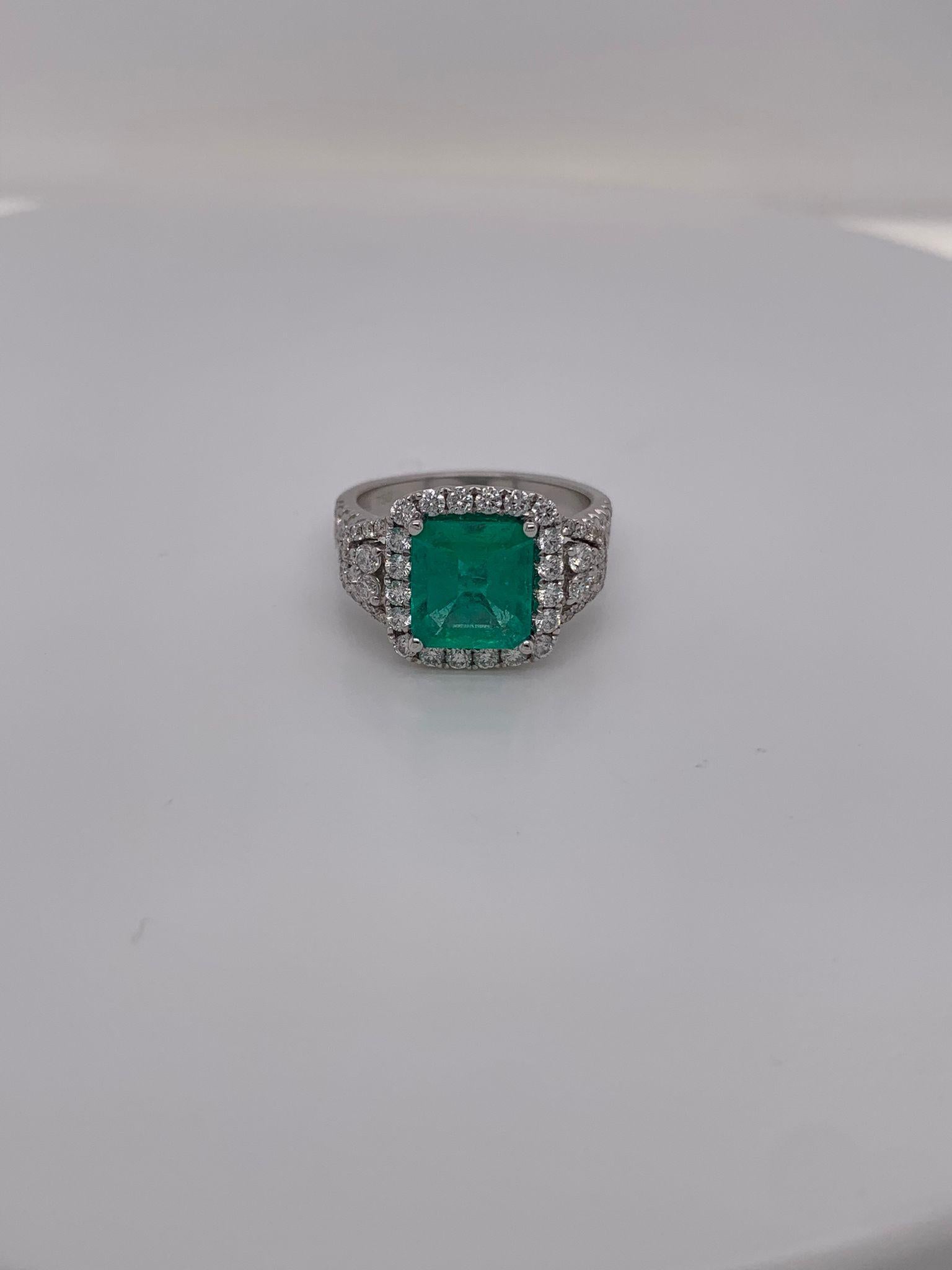 Square emerald weighing 1.86 cts
Measuring (8.6x7.8) mm
68 Round Diamonds weighing .95 cts
Set in 18K white gold ring