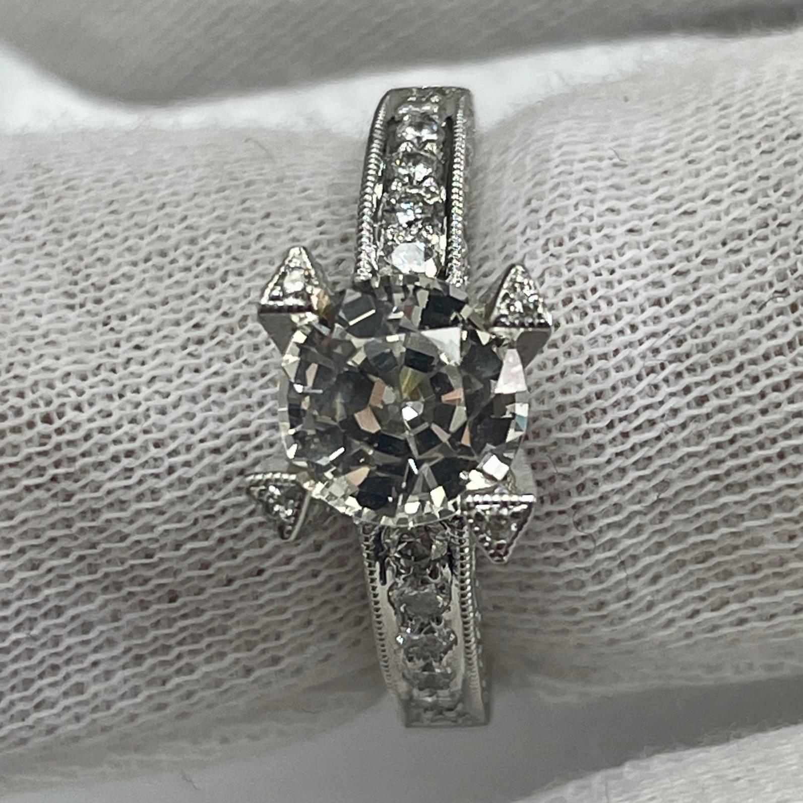 This ring has a beautiful white sapphire. This holds 14K white gold and 0.64 carats of brilliant white diamonds.