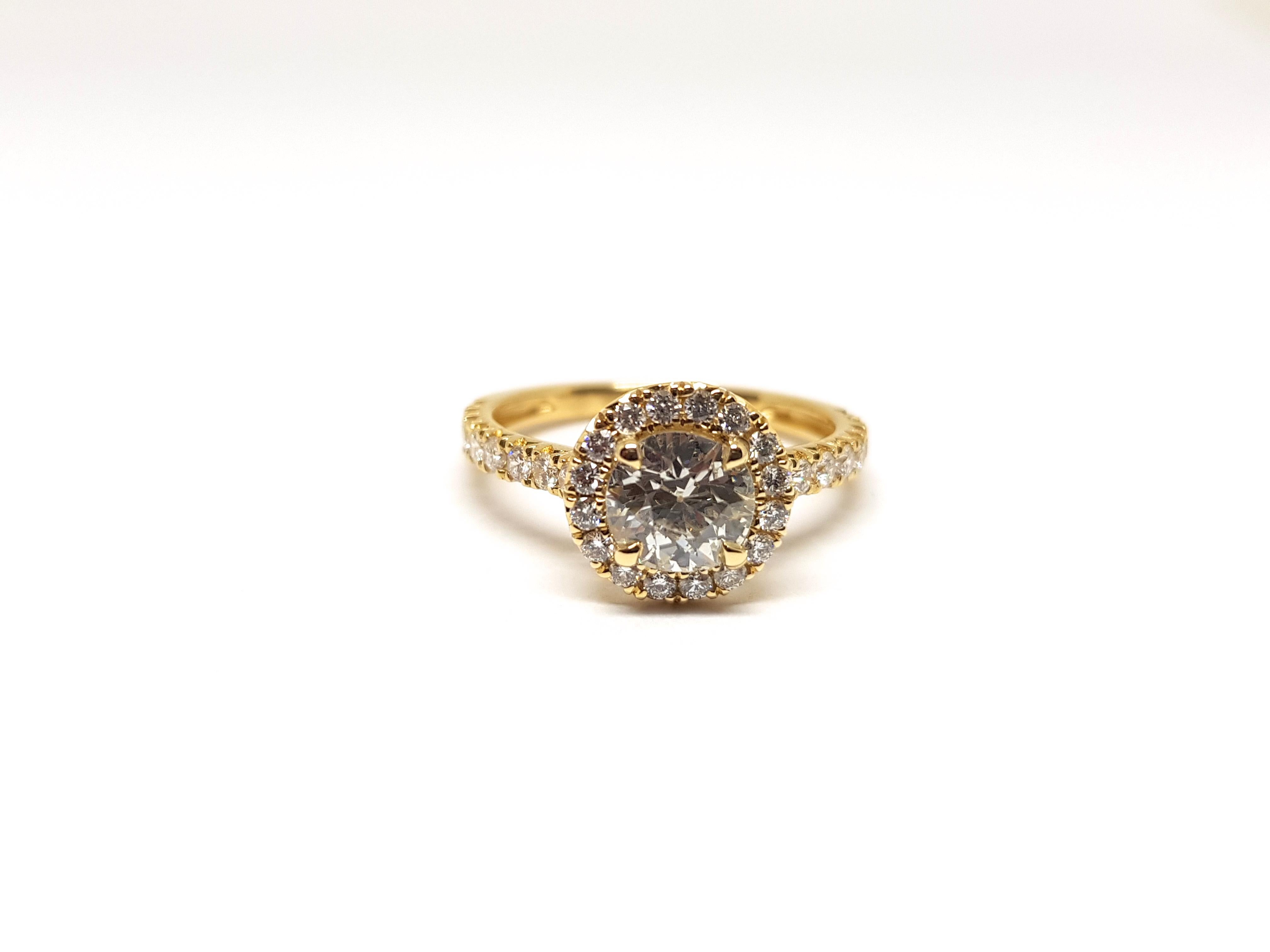 Gold: 18 Karat Yellow Gold 
Weight: 2.88gr. 
Central Diamond: 0.90 ct. Colour: H clarity: SI1 
Accent Diamonds: 0.96 ct. Colour: F clarity: VS1 
Width: 1.0 cm. 
Ring size: 53 / 17.00mm 
Free resizing of Ring up to size 70 / 22mm / US 13 
All our