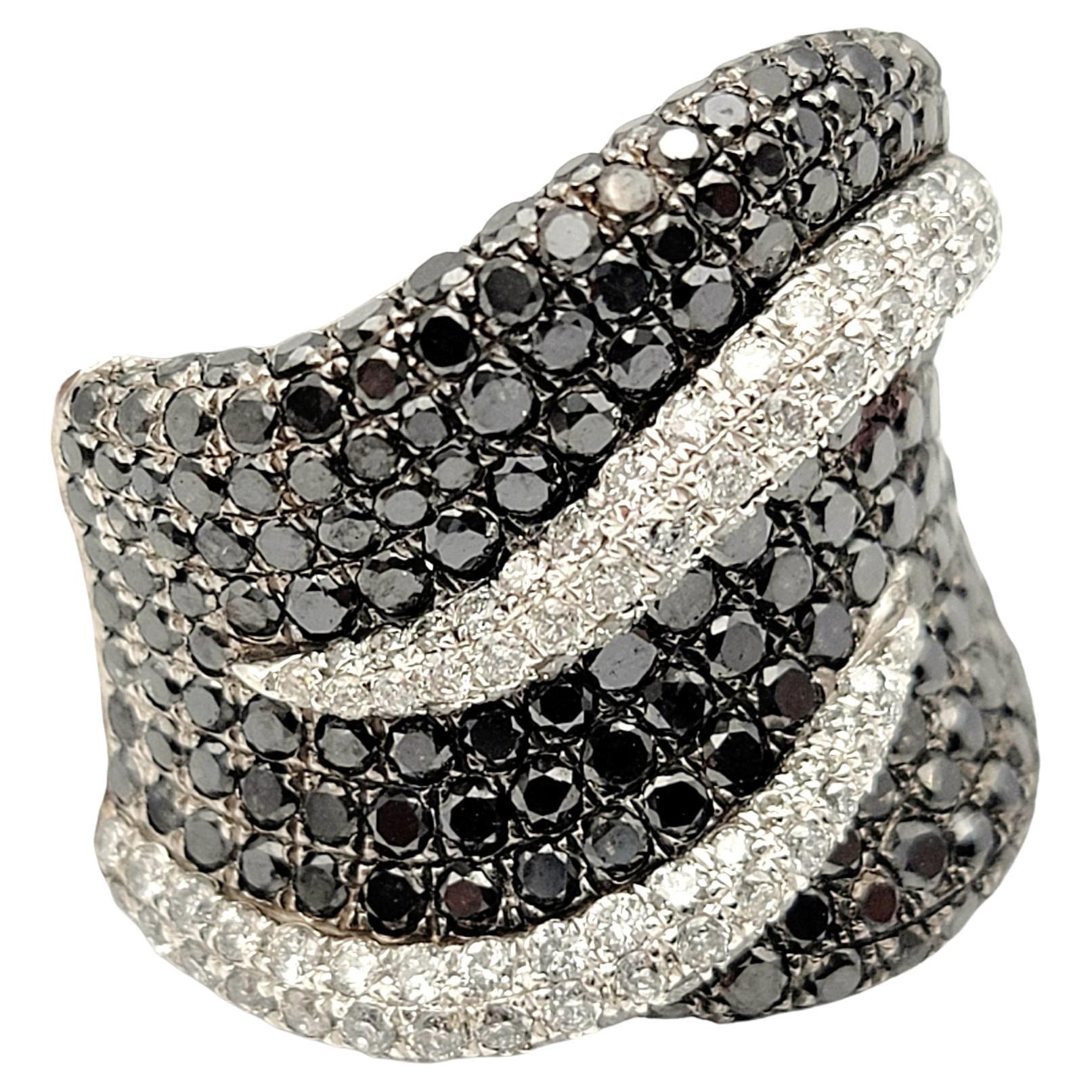 Ring size: 8

The dazzling diamond band ring exudes contemporary elegance. Bursting with sparkle, this black and white pave diamond piece offers beautiful contrast, modern design and chic sophistication. The wide style fills the finger with sparkle