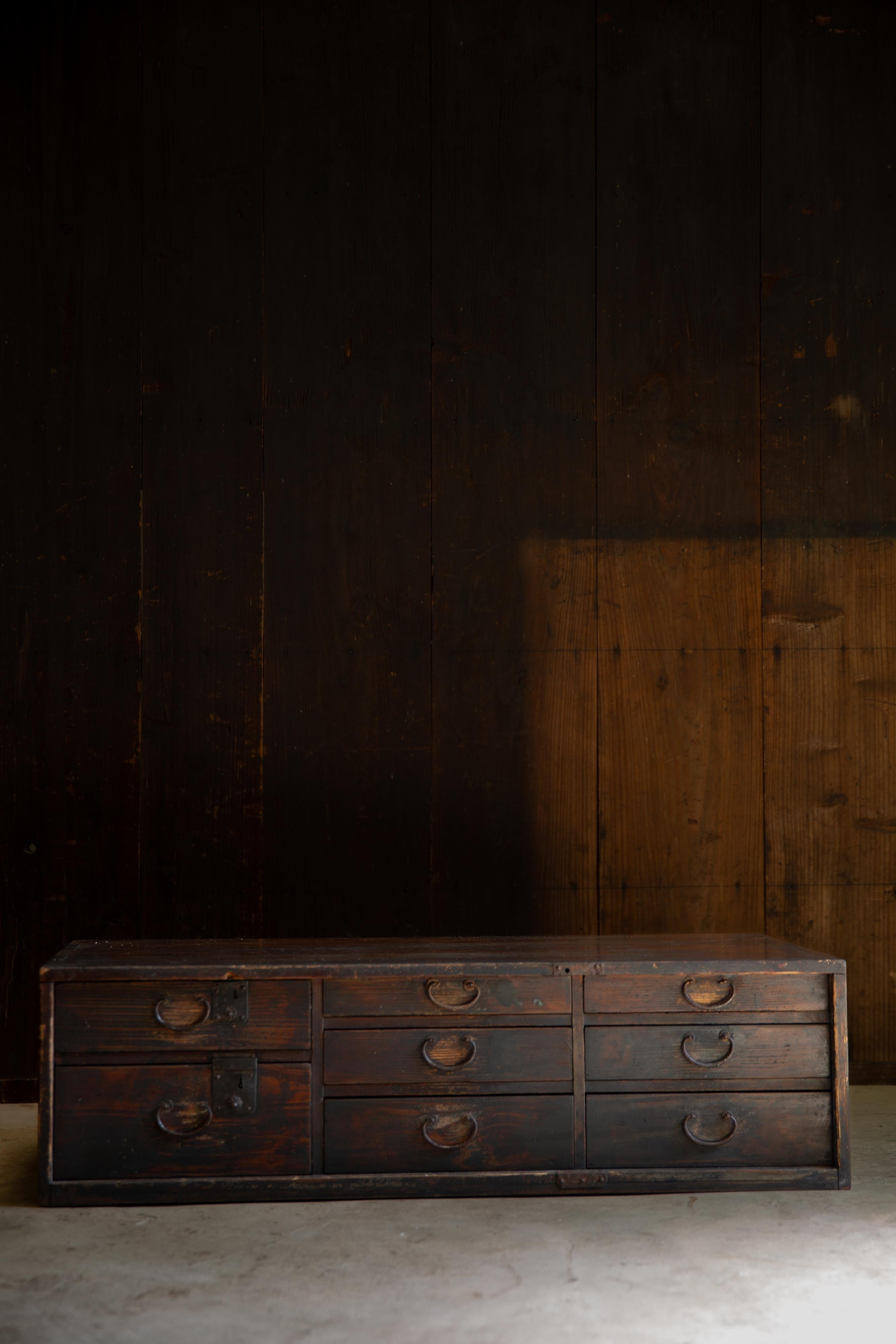 From Tohoku area, Japan. 
This mid-size, dark reddish brown Urushi lacquered Tansu chest of drawers is a product of Meiji period (1868-1912) , estimate from the style & conditions. Made of quality Sugi cedar.

Originally made with traditional wood