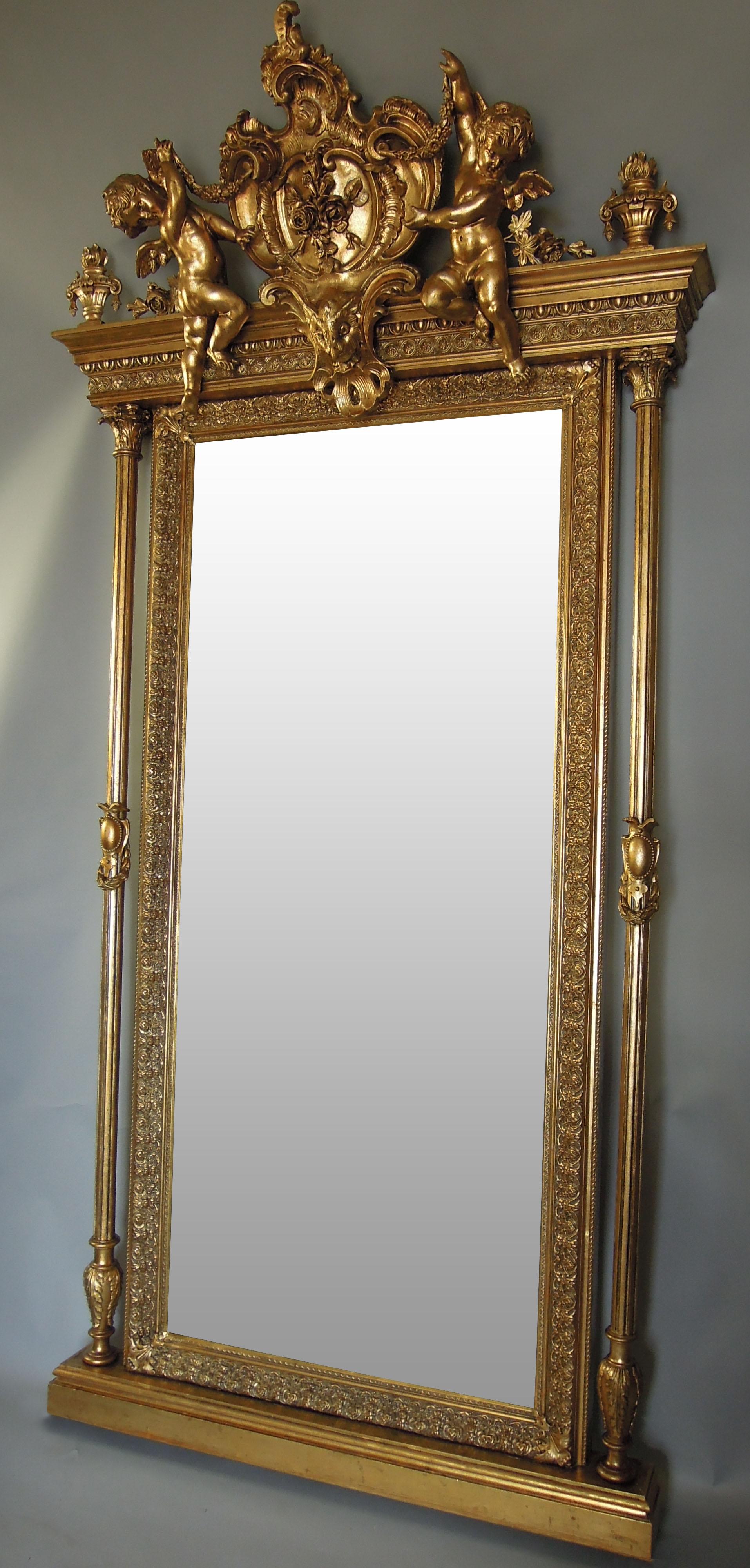 This piece was originally made in Bohemia circa 1860 to exemplify the Baroque style. The 25-carat gold plated wall mirror would have been positioned in the main entrance hallway of a villa or mansion, and with such expressive motifs of angels