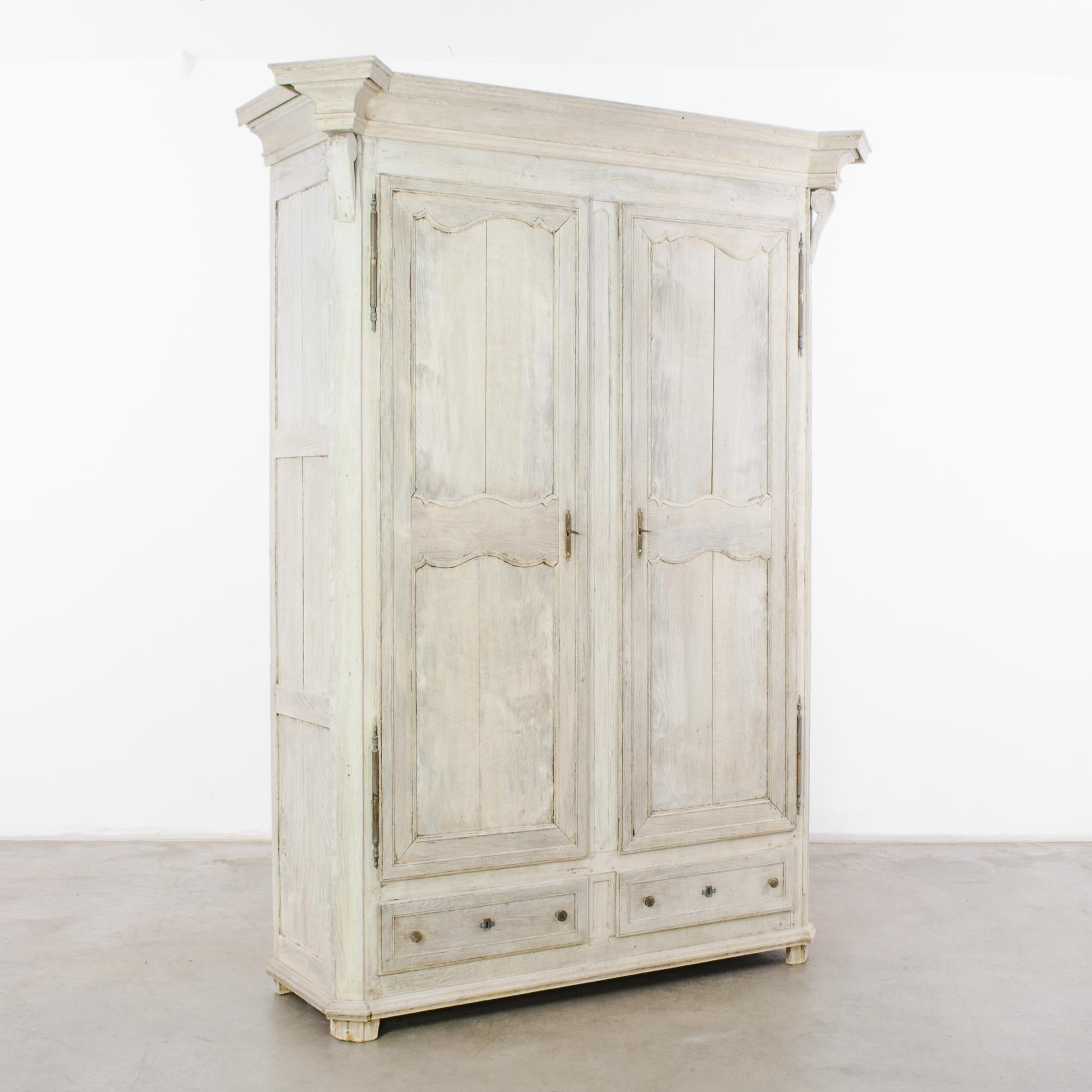 Immerse your space in the refined elegance of the 1860s with the Belgian Bleached Oak Armoire. This captivating piece features a light oak finish that exudes a timeless charm, seamlessly blending with various décor styles. With two doors and two