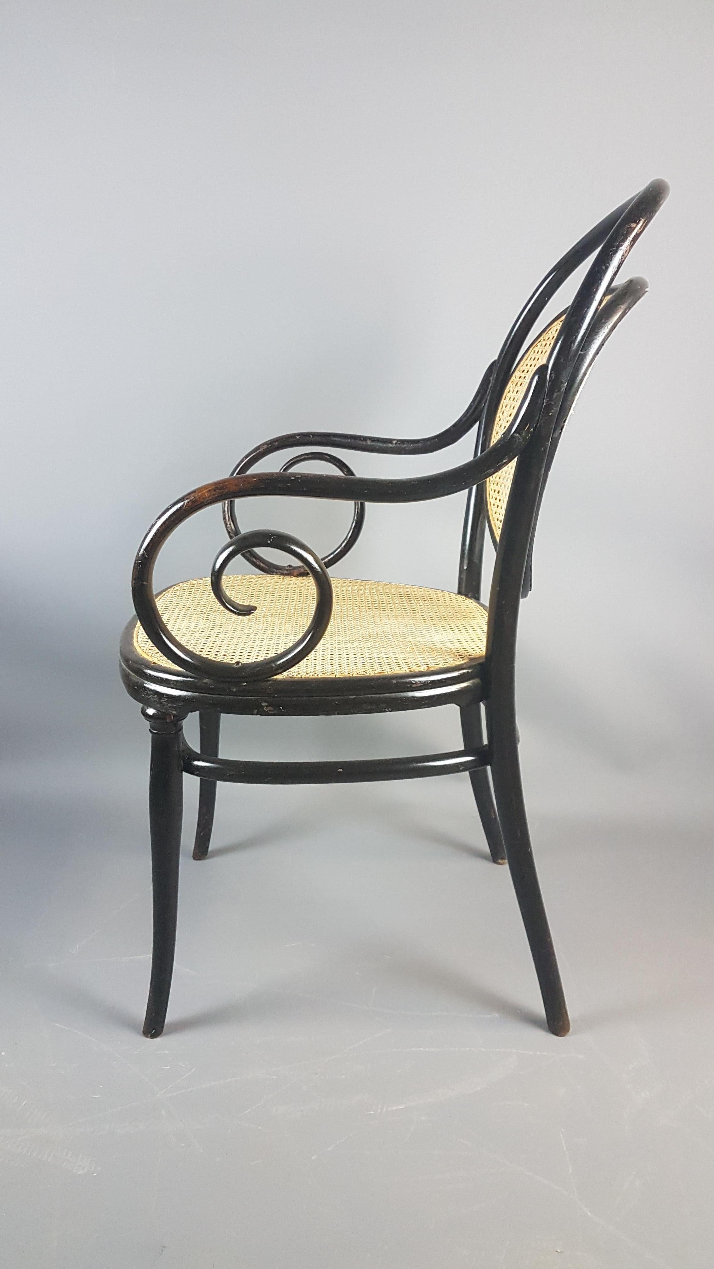 Very nice Thonet No.3 bentwood armchair circa 1860. A very elegant design of chair that fits into any traditional setting but looks just as at home in a contemporary setting or utilized as an item of furniture sculpture. The cane seat and back have