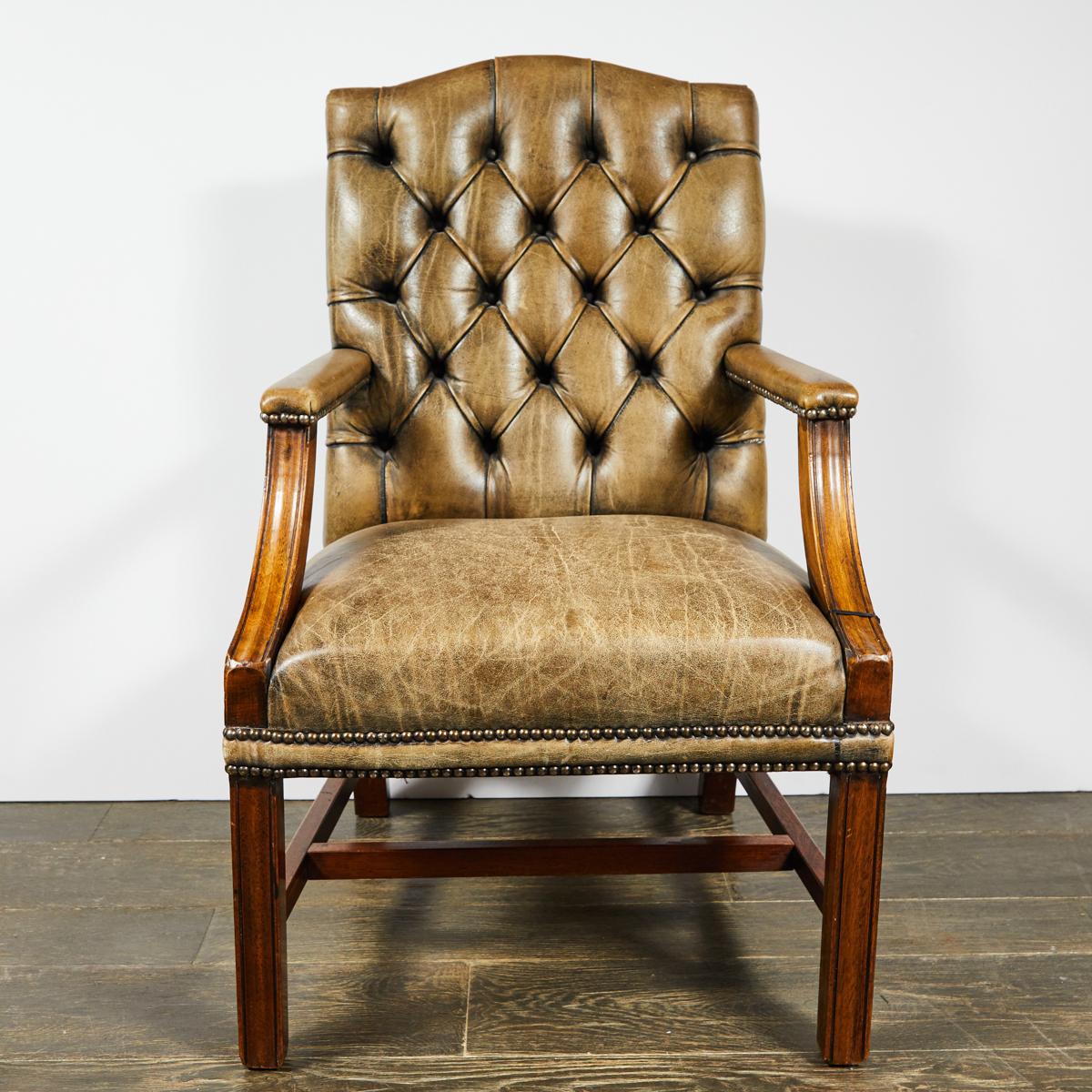 1860s Gainsborough light brown original leather upholstered tufted armchair. Wide chair with a high back, open sides, and short arms.