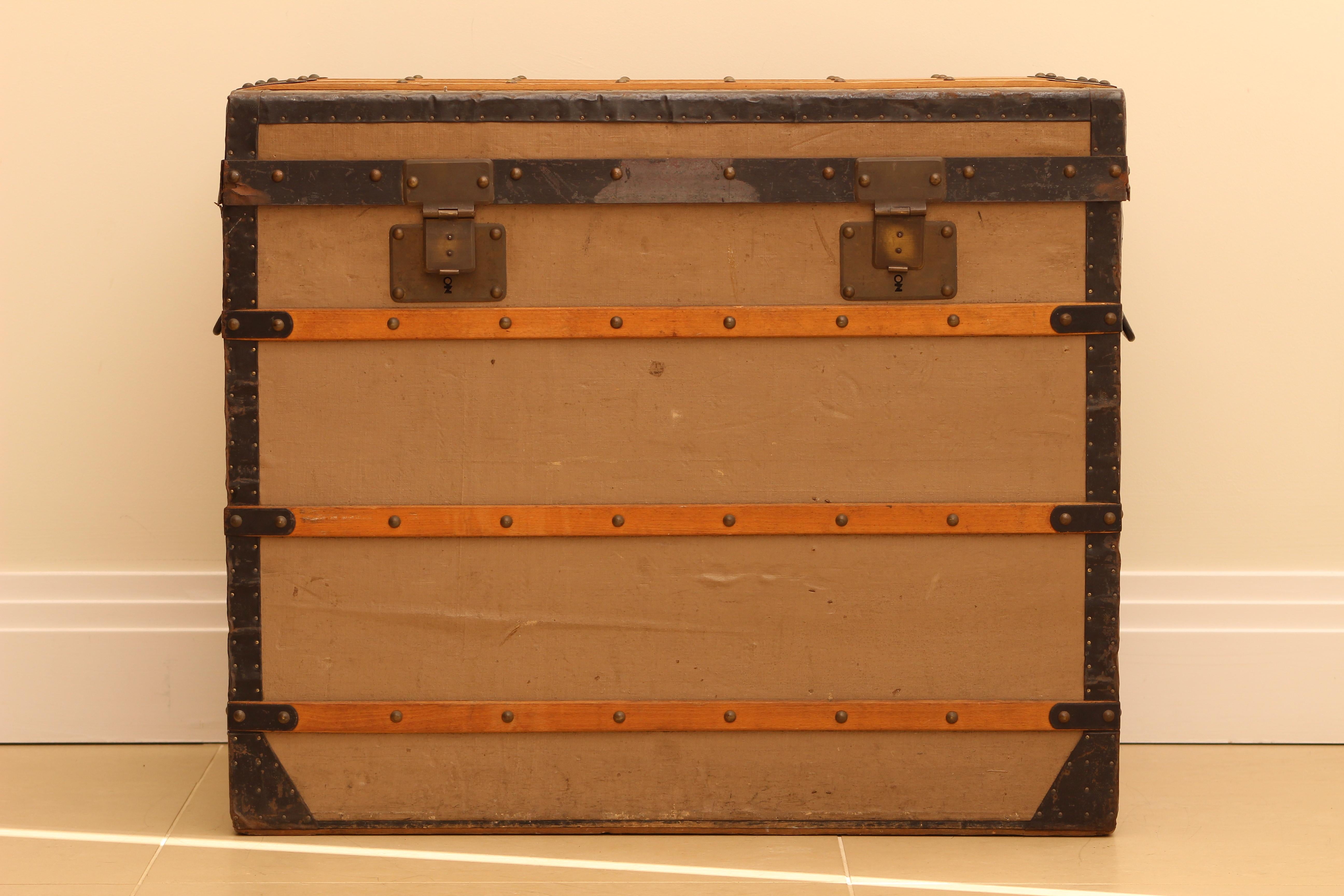 A Louis Vuitton Trianon trunk, identical to the one showcased at the Asnieres museum in Paris, stands as a testament to originality and preservation. 
This specific model mirrors the pristine condition of the piece displayed by Louis Vuitton. 
It's