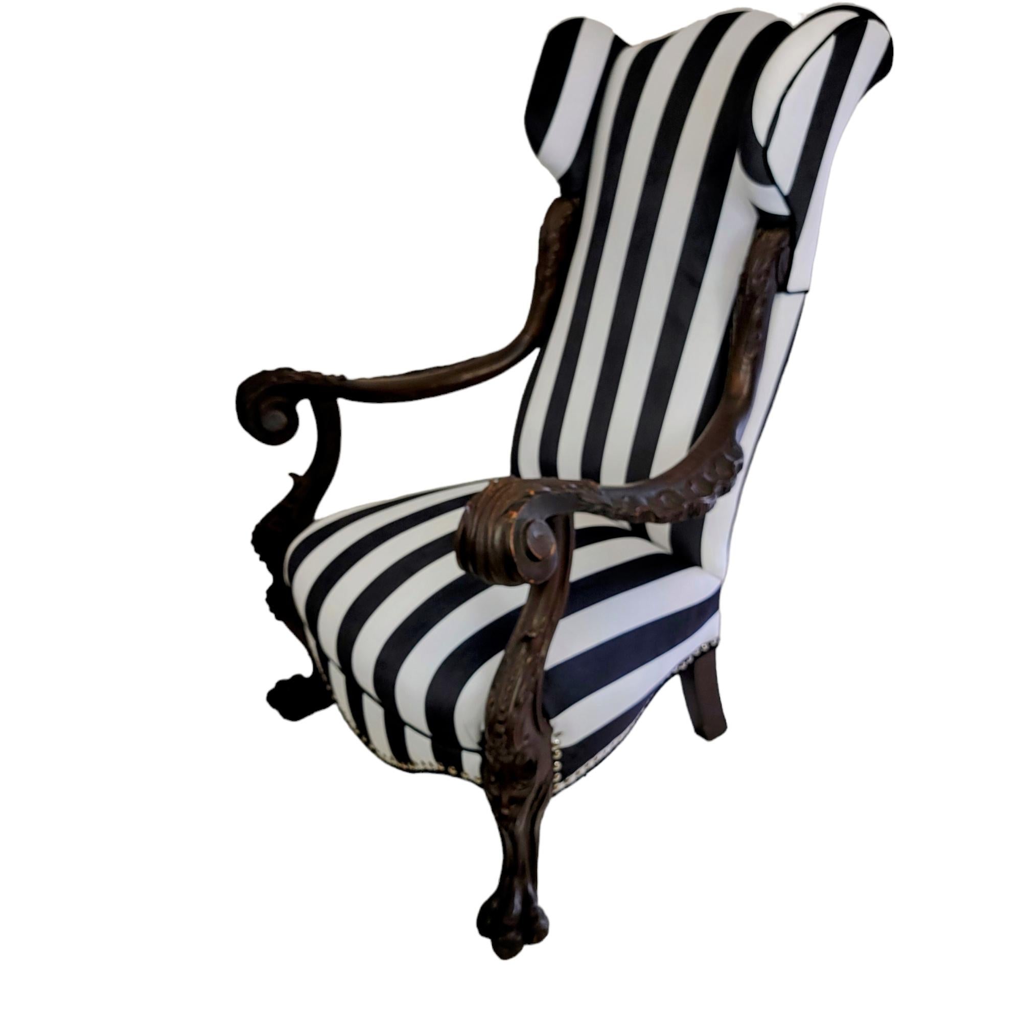Originating from the Rococo Revival period, this antique Italian wingback chair is nearly 160 years old. It has been newly reupholstered in luxurious black and white velvet, creating something remarkably different and bold to really make a room pop.
