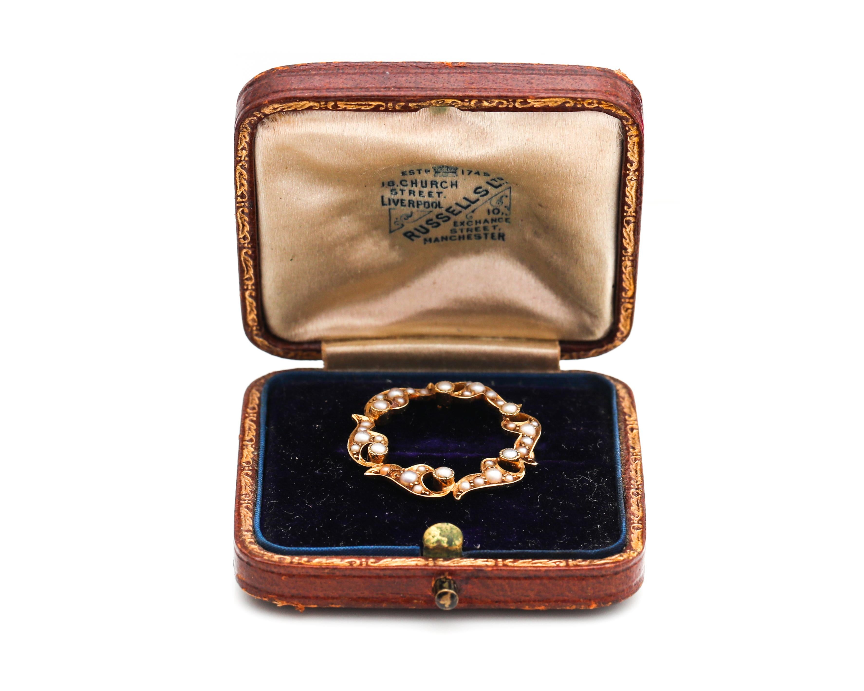 Unique antique Pin Brooch dating back to the 1860s, known as the Romantic era. This beautiful piece features antique seed pearls and is crafted in 15 karat yellow gold. 
The pin brooch is made in Manchester. It comes in the original box from the