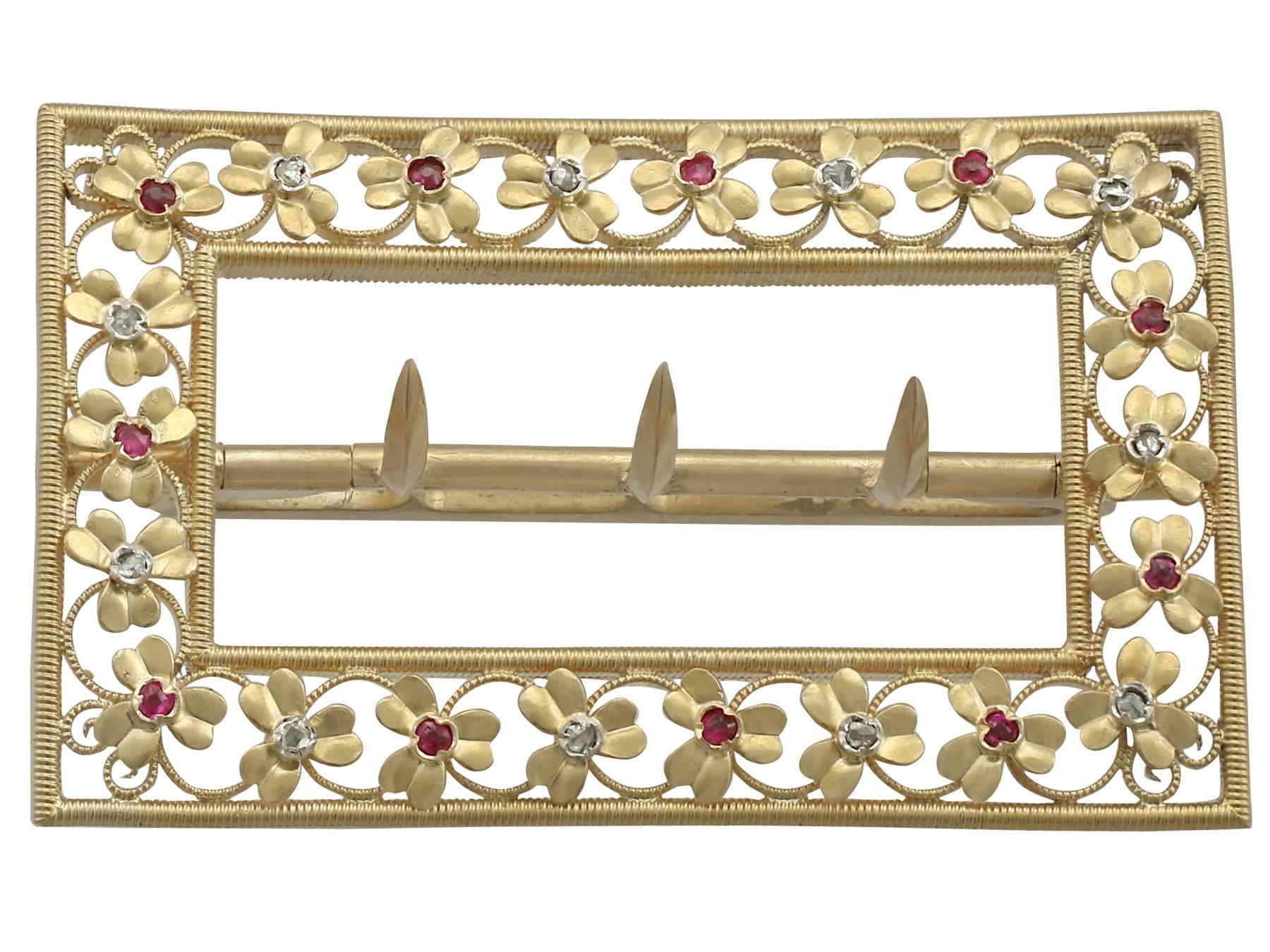 An exceptional Victorian 0.19 carat ruby and 0.18 carat diamond, 20 karat yellow gold belt buckle; part of our diverse antique jewelry and estate jewelry collections.

This exceptional Victorian belt buckle has been crafted in 20k yellow gold.

The