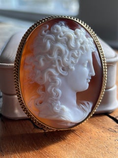 1860s Victorian Shell Cameo Brooch in 18K Yellow Gold with Braided Frame