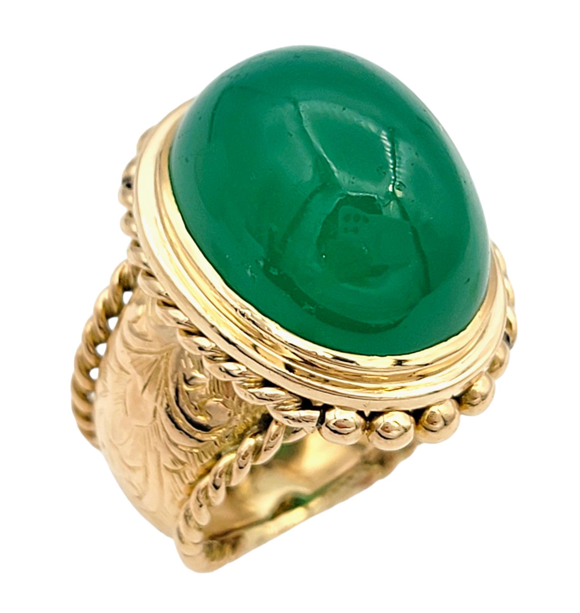 Ring Size: 5.75

This exquisite oval cabochon green chalcedony ring, set in luxurious 18 karat rose gold is a work of art. The centerpiece showcases this stunning piece is a smooth, richly hued green chalcedony, expertly cut in an oval cabochon