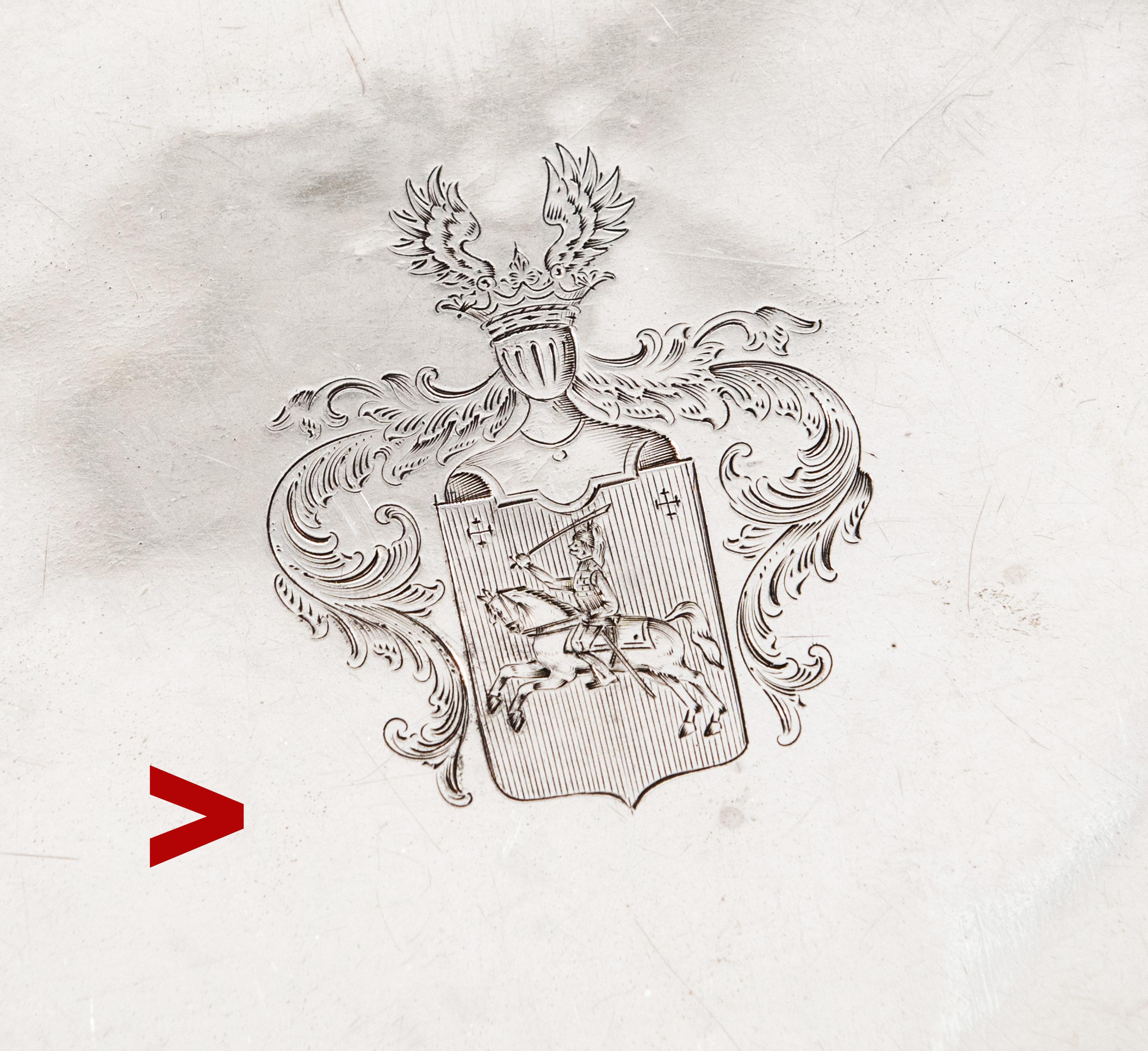 Old Russian solid Silver serving Tray or Platter with wide borders and intricate handles. Hand engraved Armorial/family crest of Russian noble family of Pechnikof(v) .

Russian Imperial 84 hallmarks on the rim, handles, and bottom. 1864 Assay marks