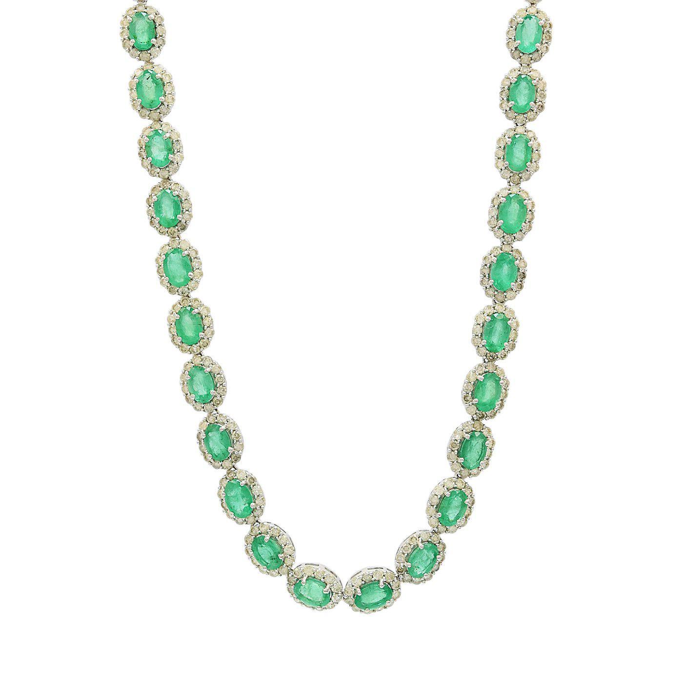 One electronically tested 14KT white gold ladies cast & assembled emerald and diamond necklace. Seventeen inch length necklace features a flexible emerald and diamond ribbon, terminating in a concealed clasp with twin safeties. Bright polish finish.