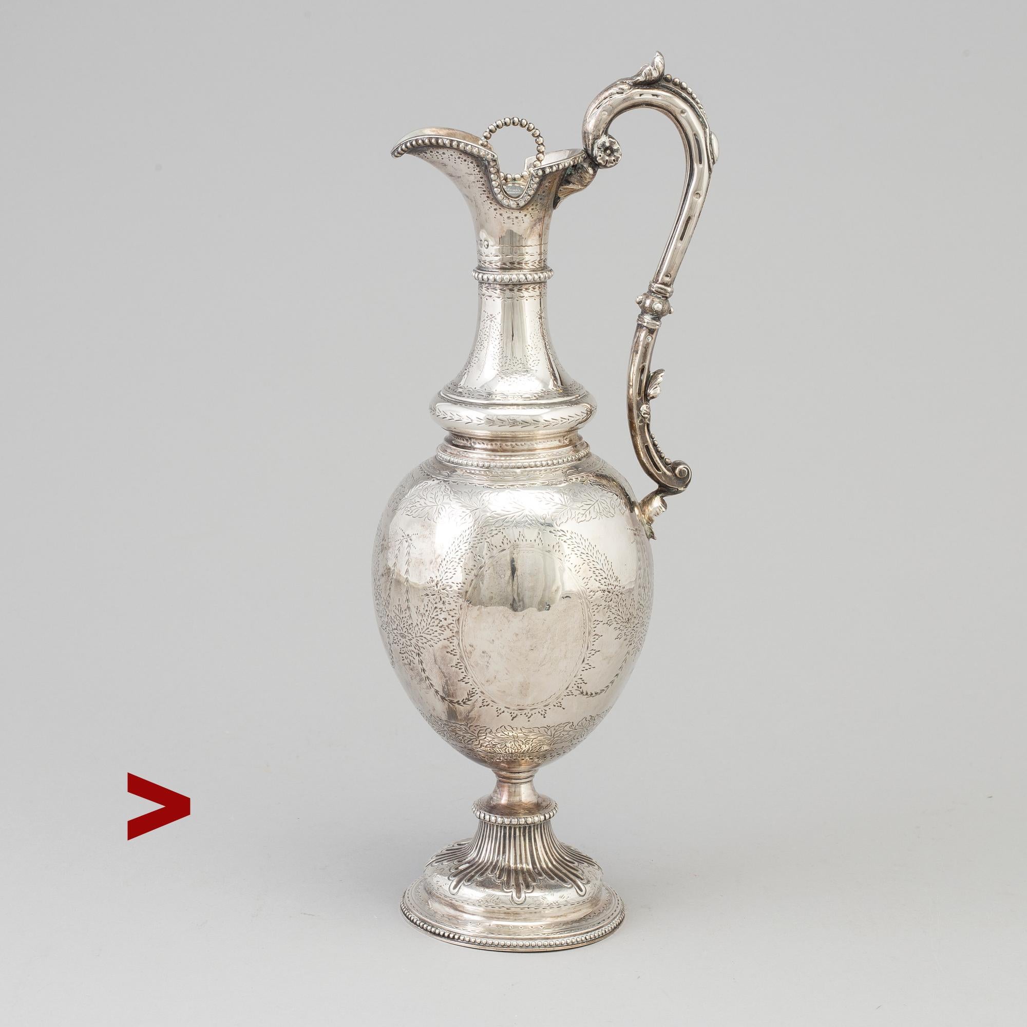 Antique Victorian Sterling Silver Wine Jug Decanter made at the workshop of Alexander Macrae, London in 1868. Full set of British hallmarks on the neck and the rim of the original stopper.

Ovoid in form with a scroll handle, the body is hand -