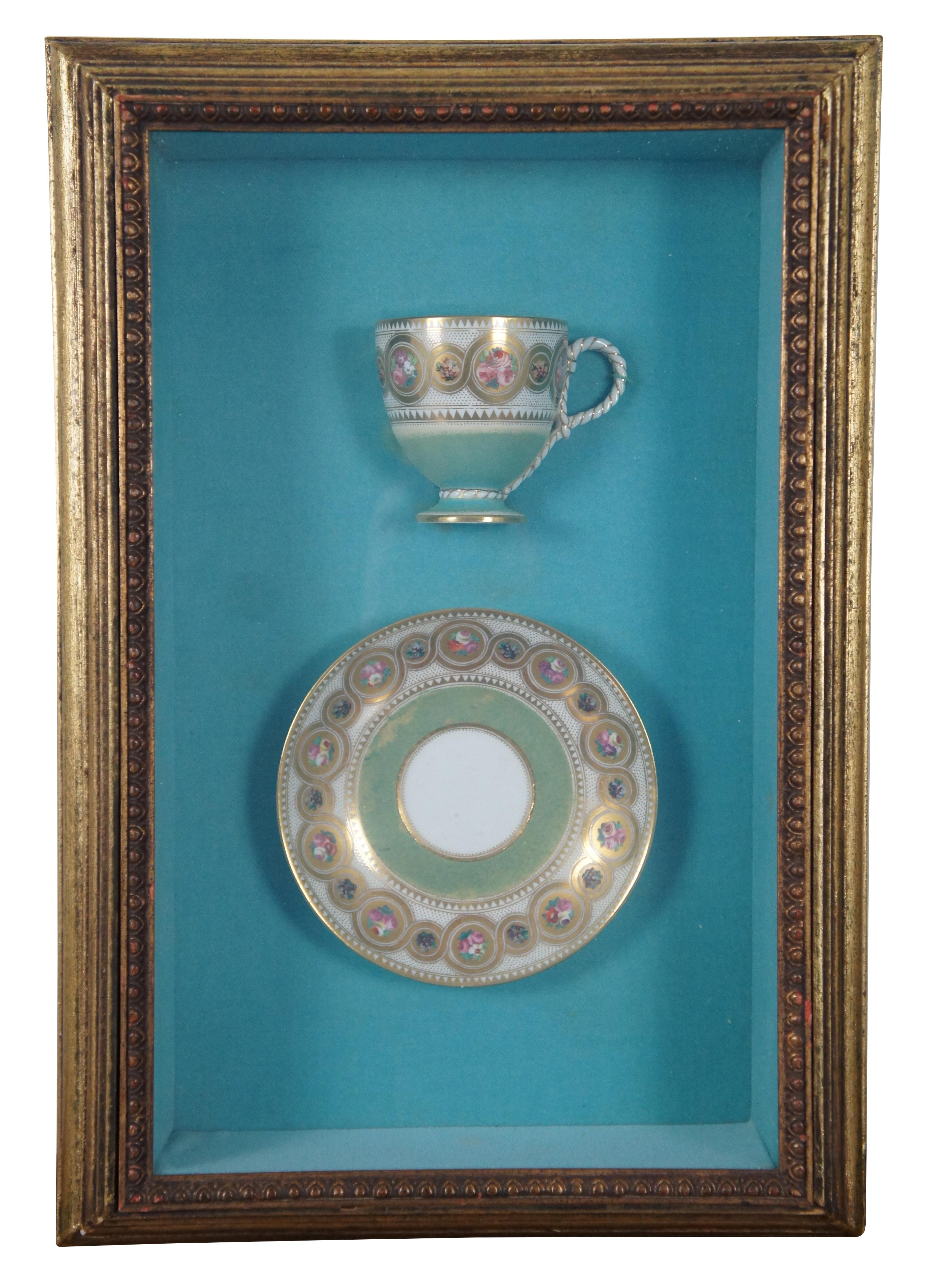 Rare antique Victorian English / British porcelain teacup / saucer and serving plate, painted turquoise, gold, and ringed with flowers and ribbon designs. Mounted in deep multi beveled frame shadowboxes with gold / blue / turquoise and egg and dart