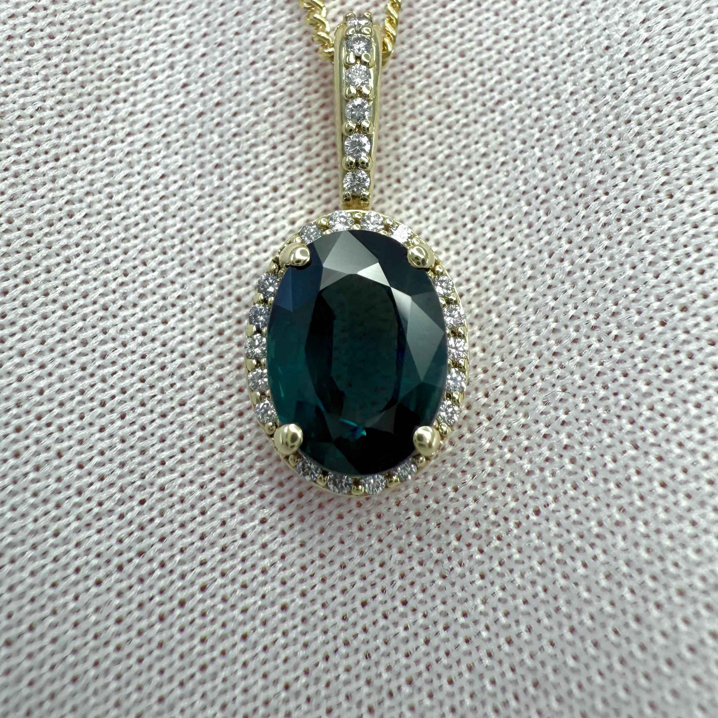 Natural Deep Teal Blue Oval Cut Sapphire And Diamond 14k Yellow Gold Halo Pendant. 1.86 Total carat.

1.80 Carat natural sapphire with a deep teal blue colour and an excellent oval cut.
This sapphire also has excellent clarity, a very clean stone.