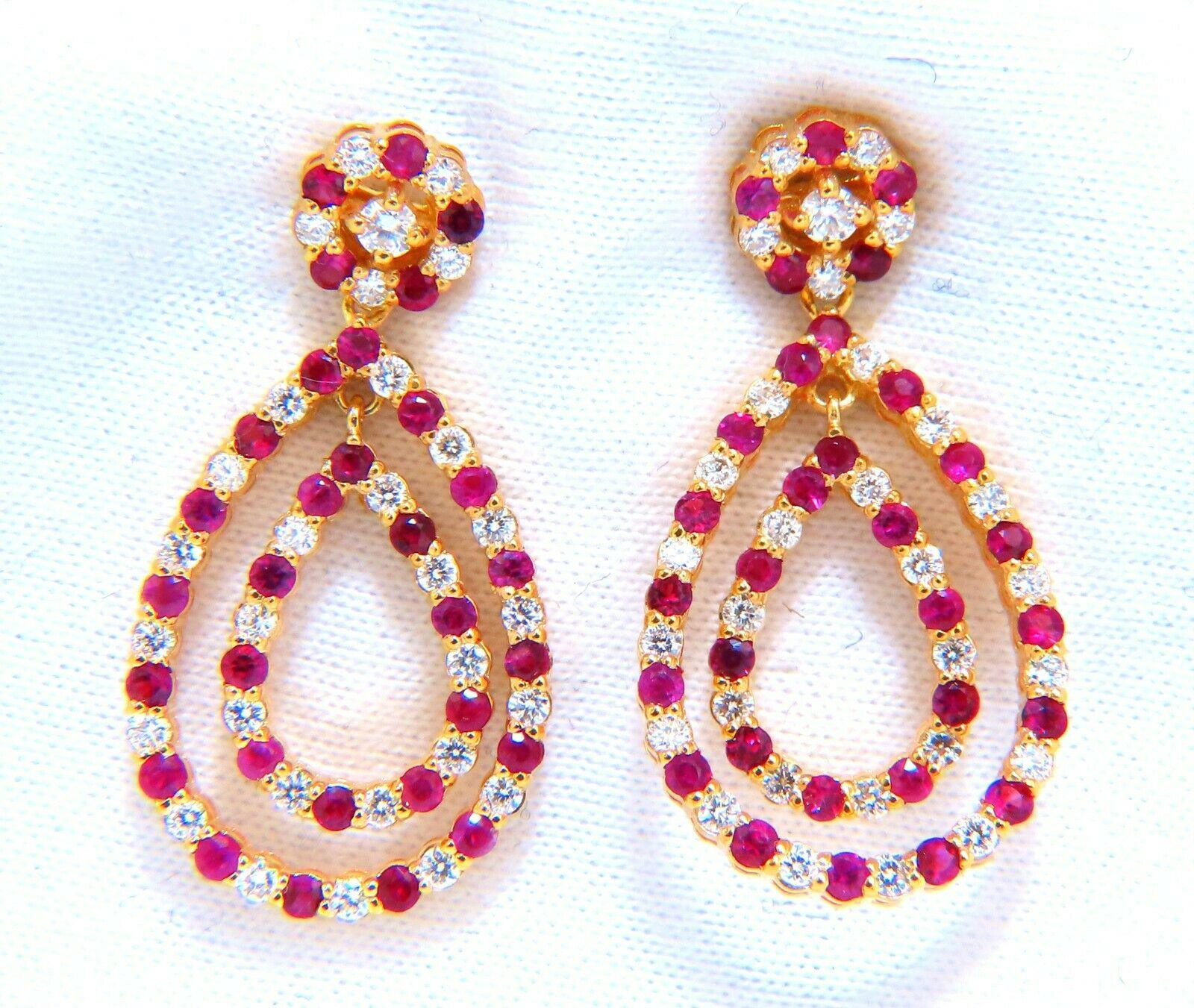 Ruby and Diamond Pear Form Dangle earrings.

1.20ct. round rubies, full brilliant cut clean clarity and transparent

.66ct. natural round diamonds G color vs2 clarity.

14 karat yellow gold 5.6 grams

28mm long 

15mm wide at largest pear