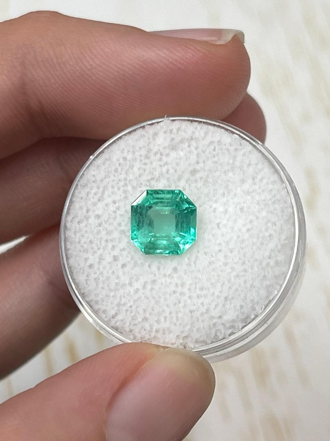 Stone: Emerald
Weight: 1.87-carats
Shape: Asscher Cut
Clarity: Transparent
Luster: Very Good-Good
Color: Pastel Medium Green
Measurements: 7.75mm x 7.64mm x 5.14mm
Geographic Origin: Colombia
Treatment: Natural, Oiling

Comments: Due to their growth
