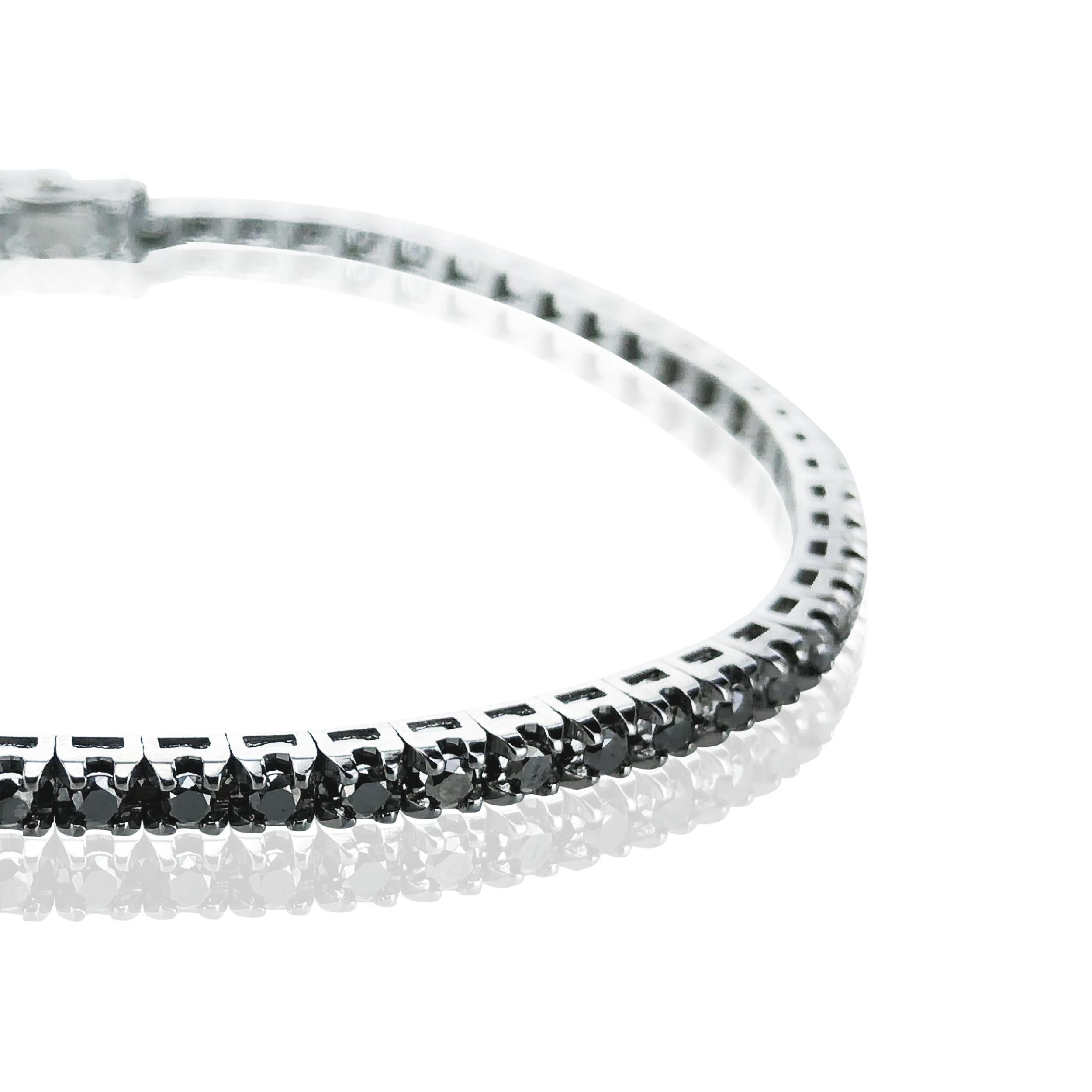 This 1.87 Carat Unisex Black Diamond Tennis Bracelet, is a stunning statement on either sex's wrist. 

Set in 18Kt Black Gold it stylishly dresses up day and night wear. 

Timelessly beautiful it is also water proof and so never needs to be taken