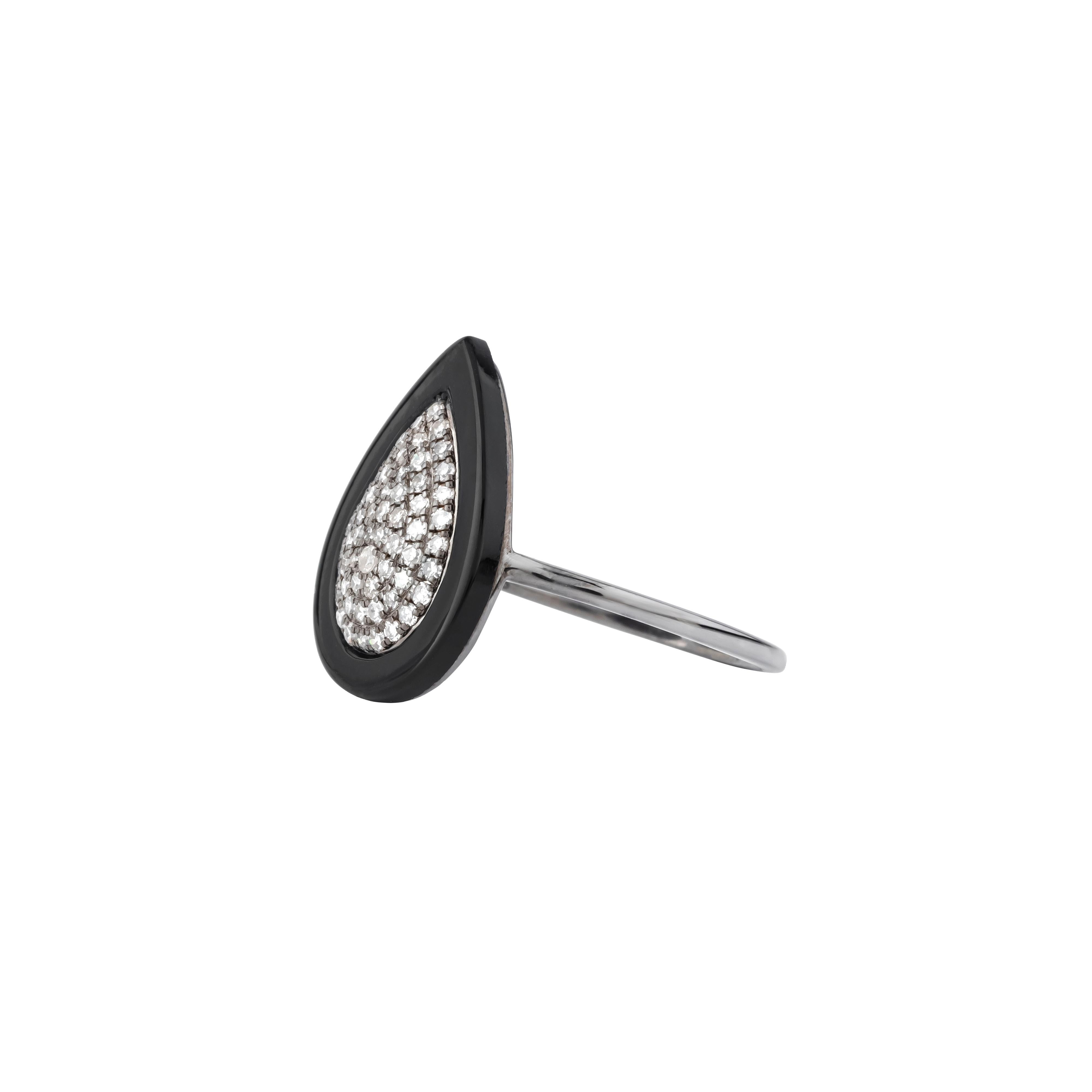 The 1.87 Carat Diamond and Black Onyx Fashion Ring embodies the perfect blend of boldness and elegance. At its heart lies a polished black onyx, its rich, velvety depth offering an arresting contrast to the brilliance of the surrounding diamonds.
