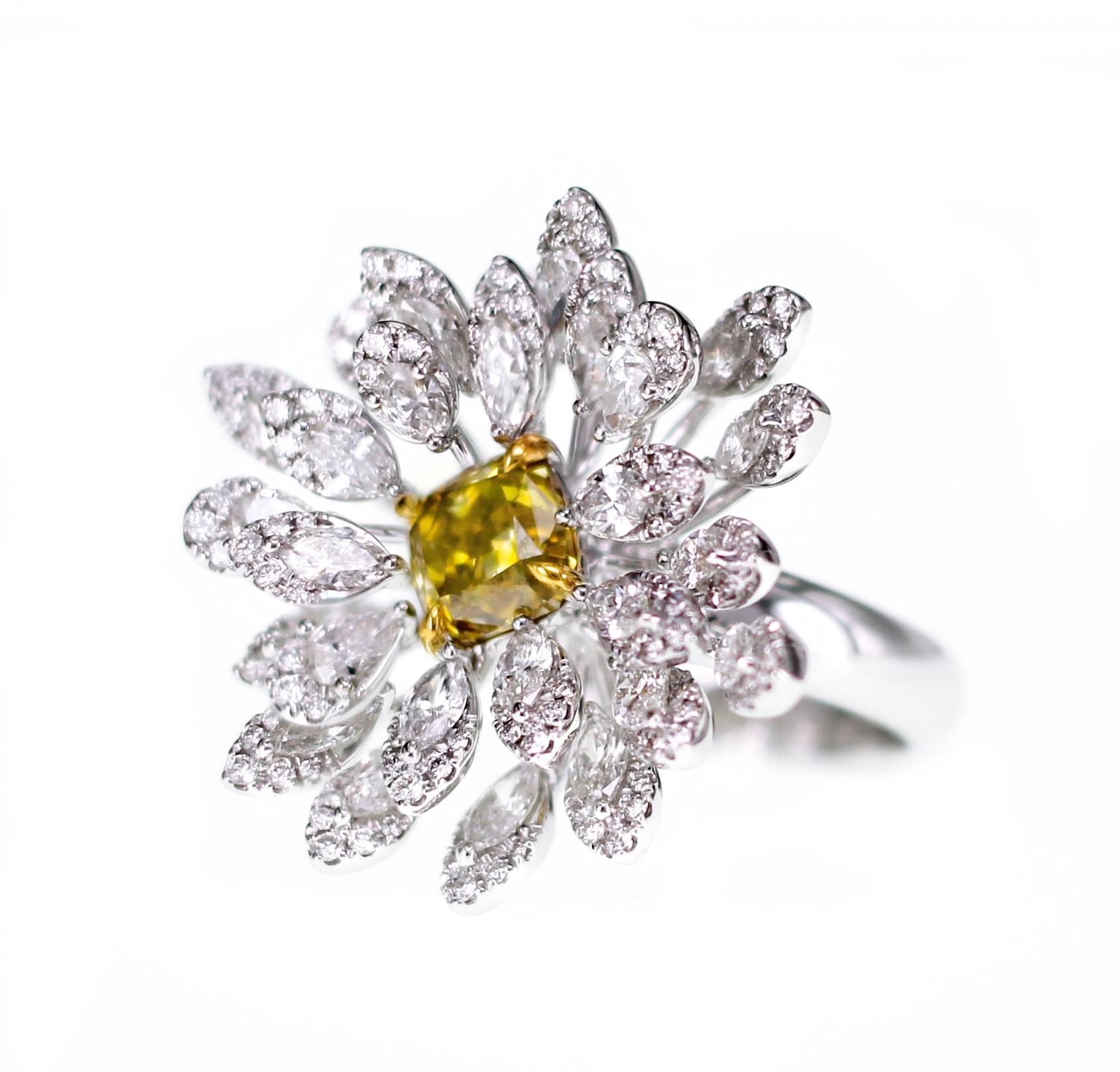 Presenting from our Grandiosa Collection, the ring has 1.87 carat of intense saturation yellow diamond with 2.88 carat of white round brilliant diamond. 
