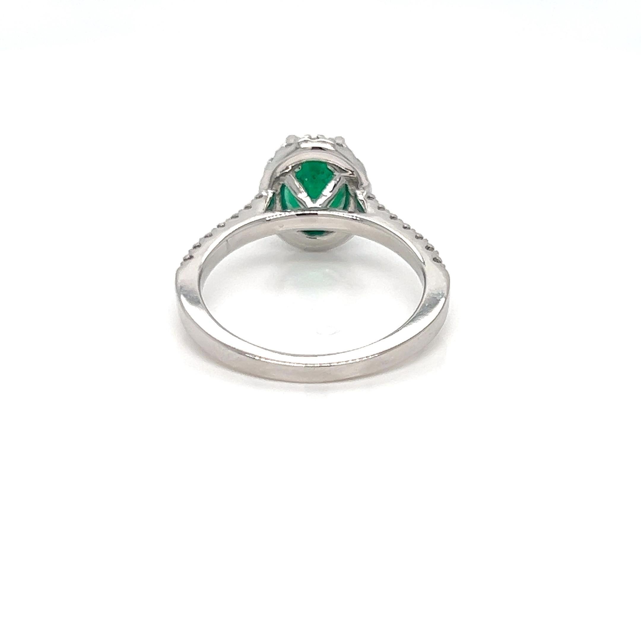 Modern 1.87 Carat Oval cut Emerald and Diamond Halo Engagement Ring  For Sale